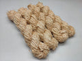 Recycled Linen Yarn Beigi is made from leftover or excessive warp/ weft thread on handlooms / powerloom, to be specific the byproduct linen from industrial Linen weaving unit in India. The yarn is hand-spun, using drop spindle helping women cooperatives to earn their livelihood.