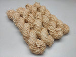 Recycled Linen Yarn Beigi is made from leftover or excessive warp/ weft thread on handlooms / powerloom, to be specific the byproduct linen from industrial Linen weaving unit in India. The yarn is hand-spun, using drop spindle helping women cooperatives to earn their livelihood.