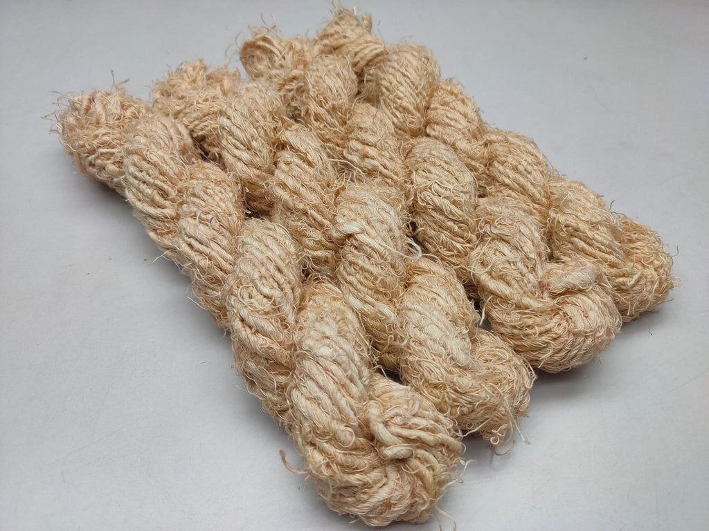 Recycled Linen Yarn Beigi is made from leftover or excessive warp/ weft thread on handlooms / powerloom, to be specific the byproduct linen from industrial Linen weaving unit in India. The yarn is hand-spun, using drop spindle helping women cooperatives to earn their livelihood.