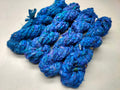 Braided Sari Silk Ribbon yarn is made of pure silk and is approximately an inch wide through out. Due to its handmade nature there might occasionally be variations in width. When silk fabric is cut and made into saris, wraps, and veils, there is always a bit left over. Rather than throw that waste fiber into the trash, it has been made into a beautiful, unique, soft yarn..!! Direct from India, this yarn is a truly recycled product. It is a bulky weight and is soft and easy to knit or croc