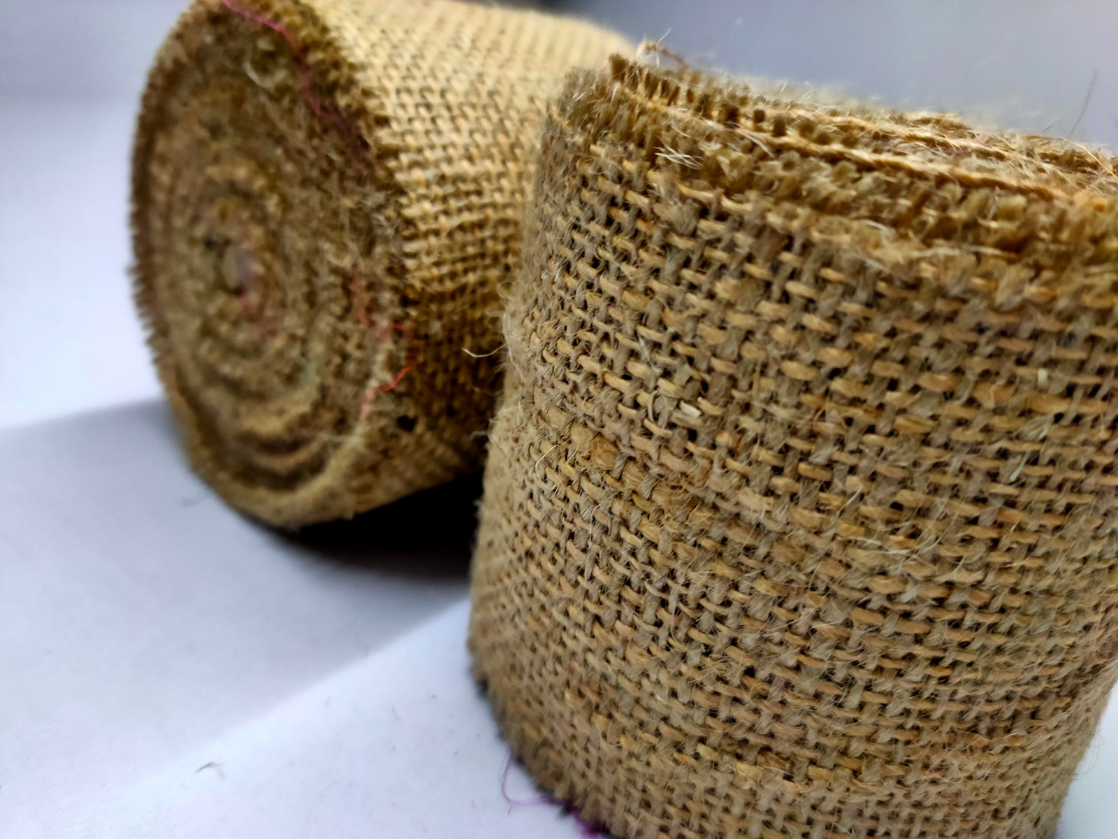Recycle Burlap Ribbon is not your ordinary fiber. It's rough but you can make things that need to be rough and ready. Made from reclaimed burlap Sheets. This Burlap Ribbon can bear the heat (and the cold) better than some finer fibers. Bring some organic elegance to your next project or gift wrap