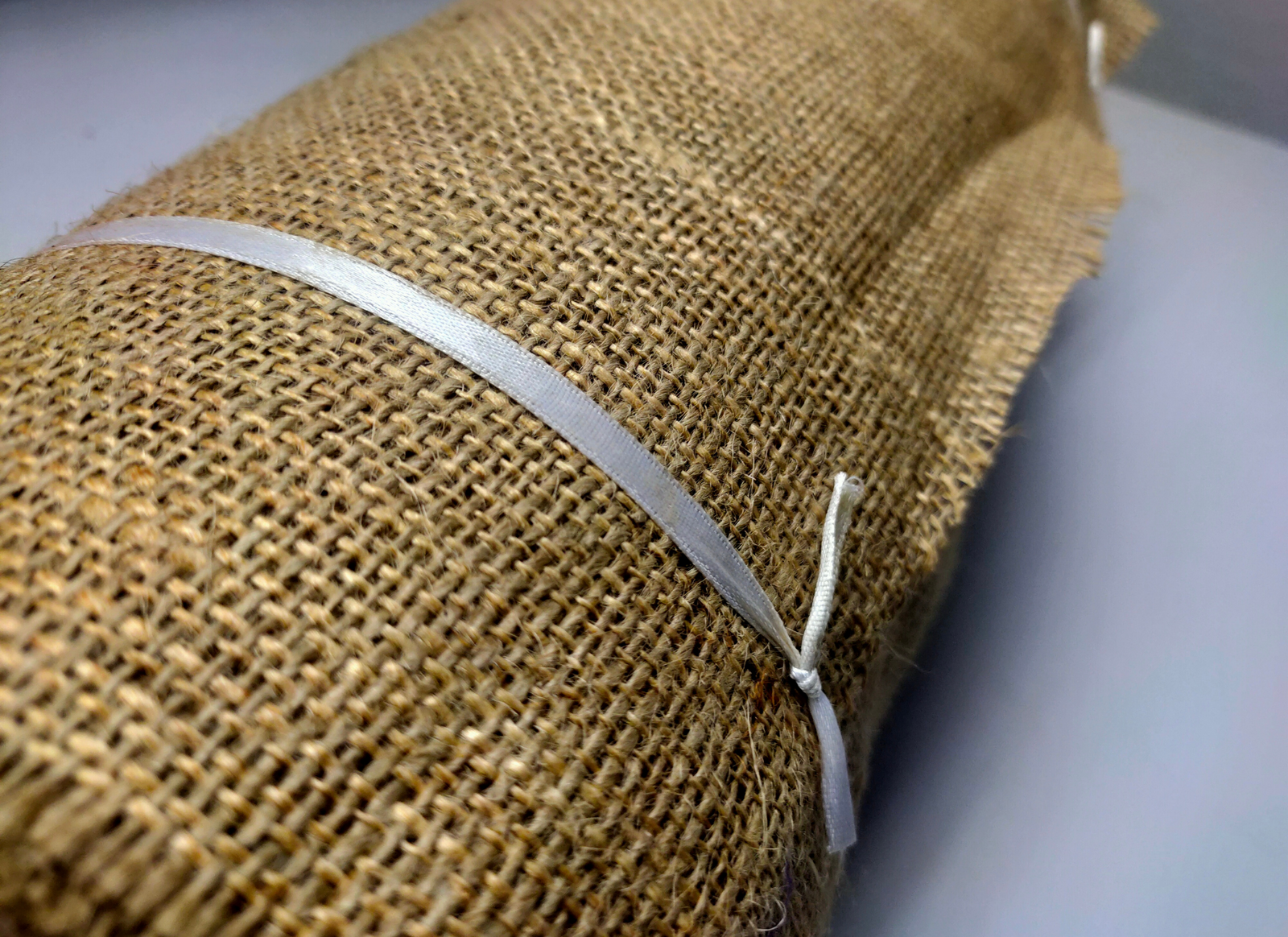 Recycled Burlap Ribbon : It is not your ordinary fiber. It's rough but you can make things that need to be rough and ready. Made from reclaimed burlap Sheets. This Burlap Ribbon can bear the heat (and the cold) better than some finer fibers. Bring some organic elegance to your next project or gift wrap!