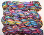 Cording Sari Silk Ribbon - Multicolor - SilkRouteIndiaFair Trade Recycled Lurex Hemmed Cording Sari Silk Ribbon yarn. Very sparkling! Made from Recycled Sari silk Ribbon which is the by-product of colorful saris that women wear in India. It is the loose ends of saris collected from industrial mills in India that is torn in stripes and sewn end to end to make beautiful and colorful ribbons. The vibrant colors and unique texture of these silk fabric, the s