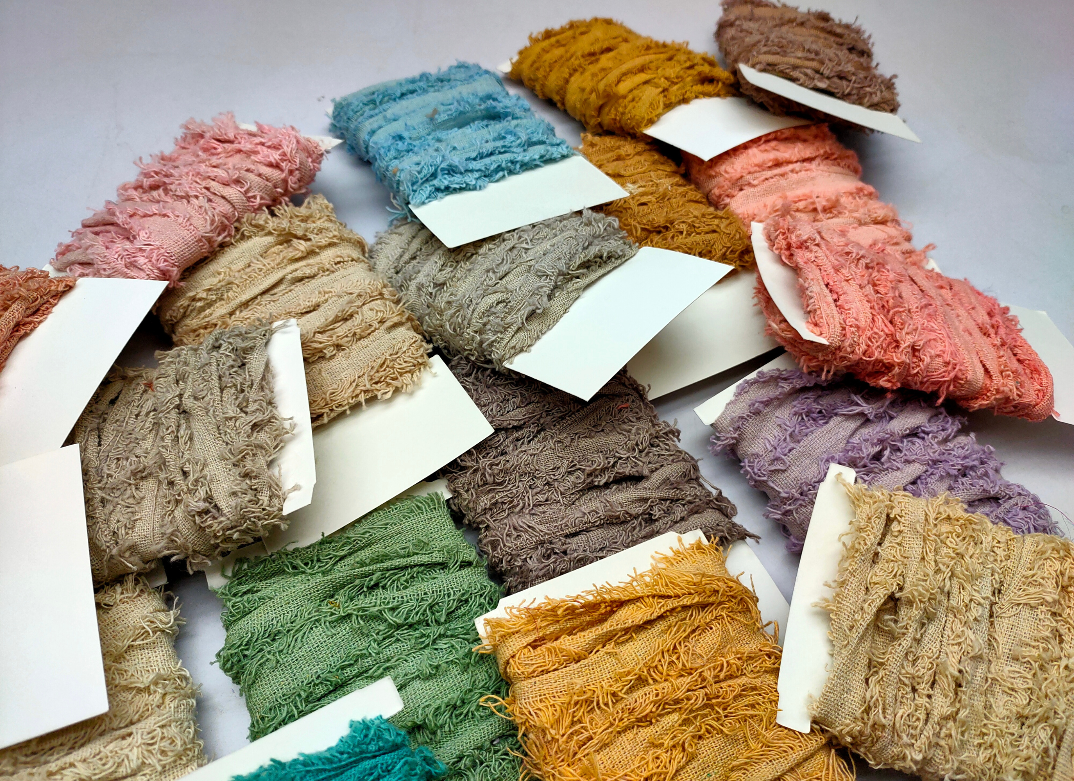 Recycled cotton frizz ribbon is perfect for incorporating into weavings and adding contrasting texture. Cotton frizz ribbon can be used for creating home goods, rugs, wall art, and more. This recycled cotton ribbon is fair trade, ethically sourced from India, and hand dyed in small batches.