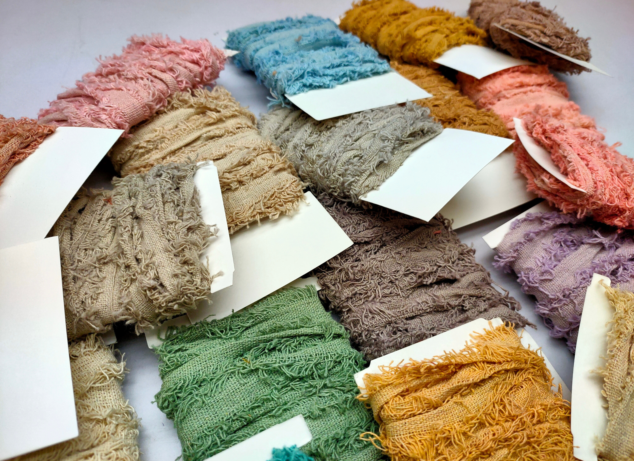 Recycled cotton frizz ribbon is perfect for incorporating into weavings and adding contrasting texture. Cotton frizz ribbon can be used for creating home goods, rugs, wall art, and more. This recycled cotton ribbon is fair trade, ethically sourced from India, and hand dyed in small batches.