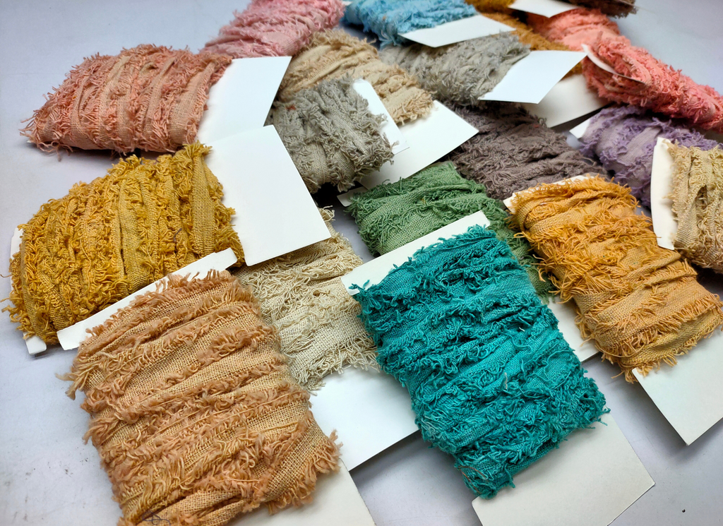 Recycled cotton frizz ribbon is perfect for incorporating into weavings and adding contrasting texture. Cotton frizz ribbon can be used for creating home goods, rugs, wall art, and more. This recycled cotton ribbon is fair trade, ethically sourced from India, and hand dyed in small batches.