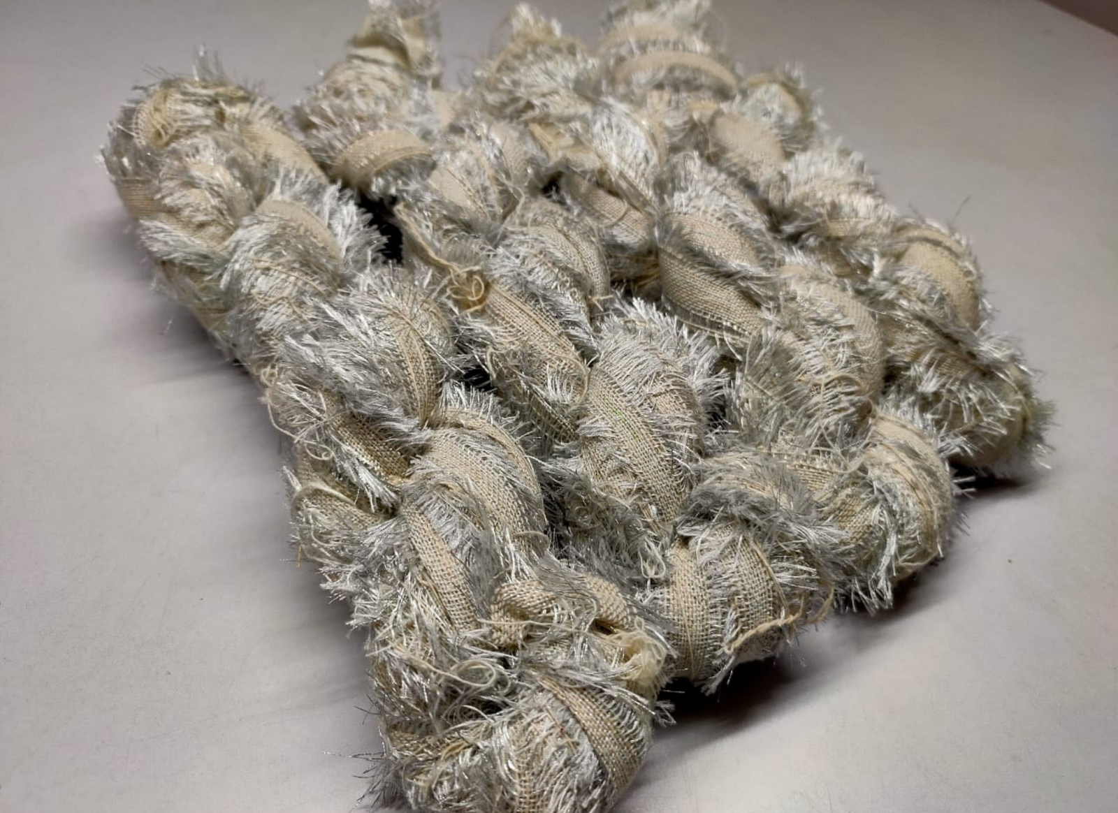 Recycled Metallic Frizz Ribbon is perfect for incorporating into weavings and adding contrasting texture. Metallic Frizz Ribbon can be used for creating home goods, rugs, wall art, and more. This recycled cotton ribbon is fair trade, ethically sourced from India, and hand dyed in small batches.