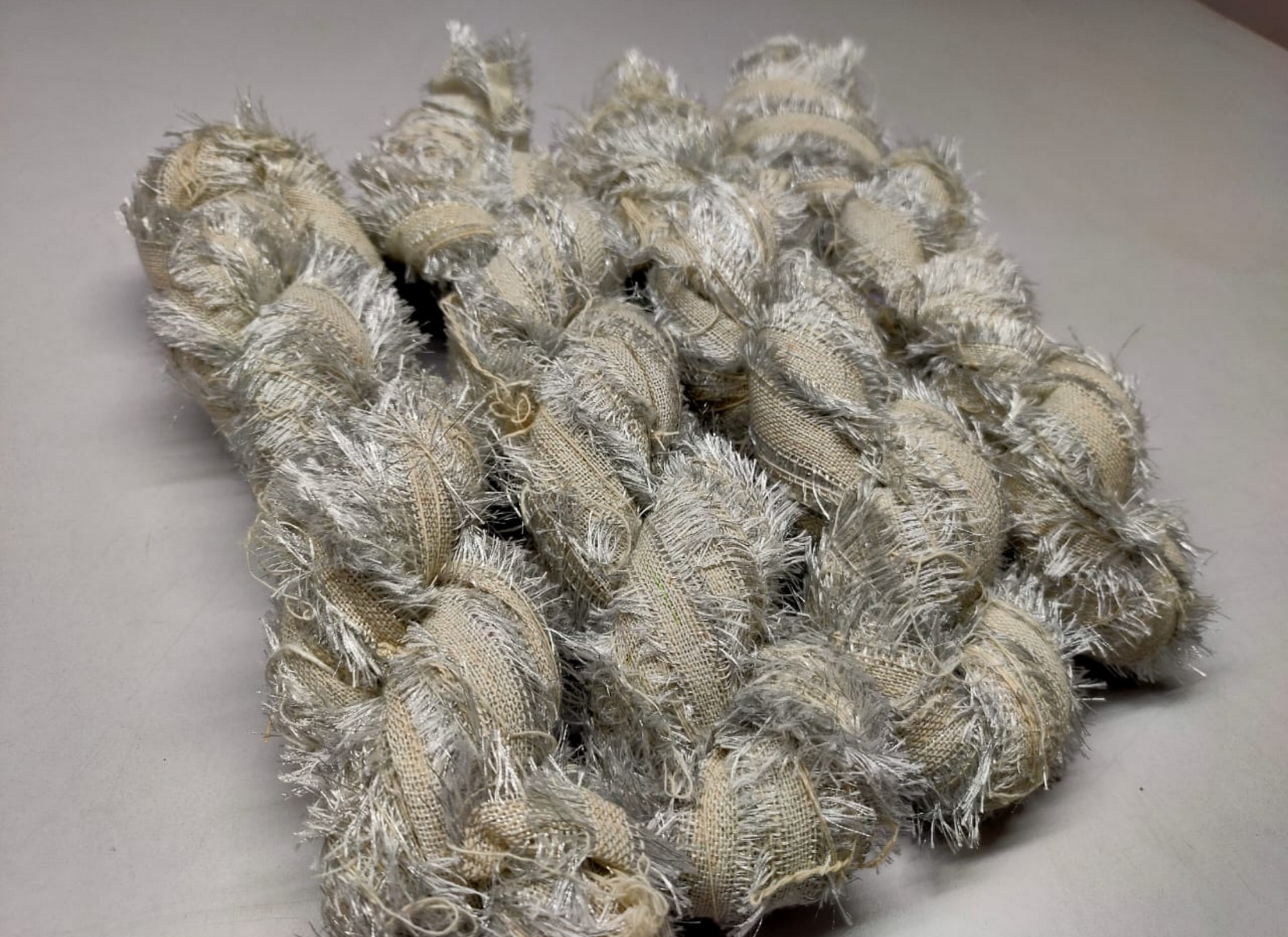 Recycled Metallic Frizz Ribbon is perfect for incorporating into weavings and adding contrasting texture. Metallic Frizz Ribbon can be used for creating home goods, rugs, wall art, and more. This recycled cotton ribbon is fair trade, ethically sourced from India, and hand dyed in small batches.