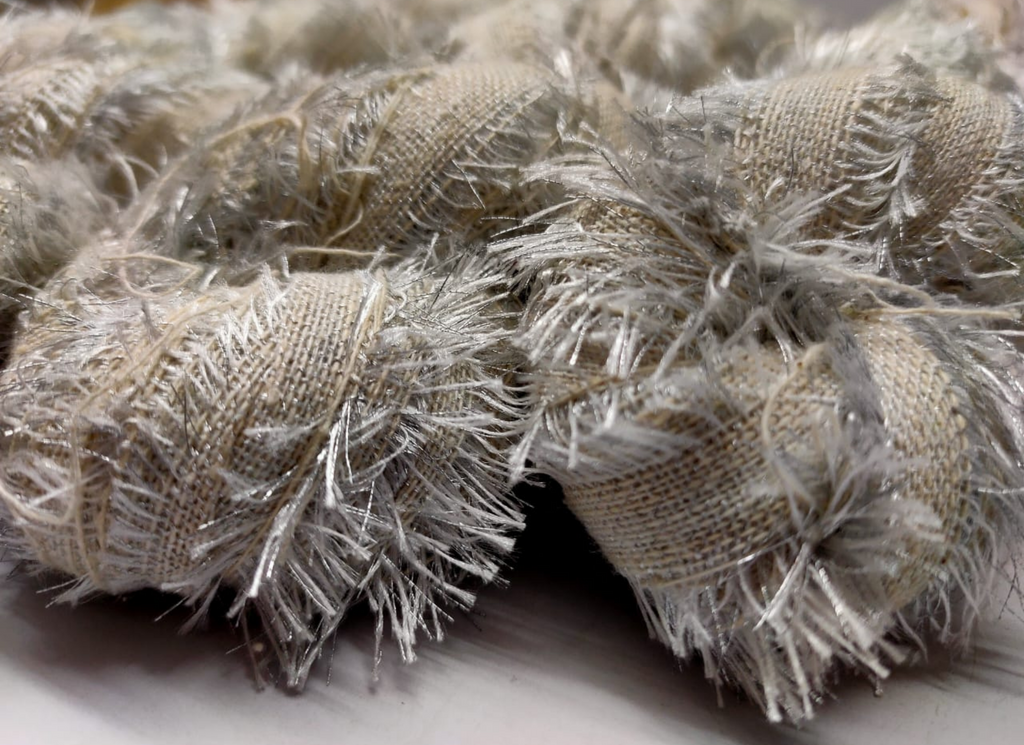 Recycled Metallic Frizz Ribbon is perfect for incorporating into weavings and adding contrasting texture. Metallic Frizz Ribbon can be used for creating home goods, rugs, wall art, and more. This recycled cotton ribbon is fair trade, ethically sourced from India, and hand dyed in small batches.