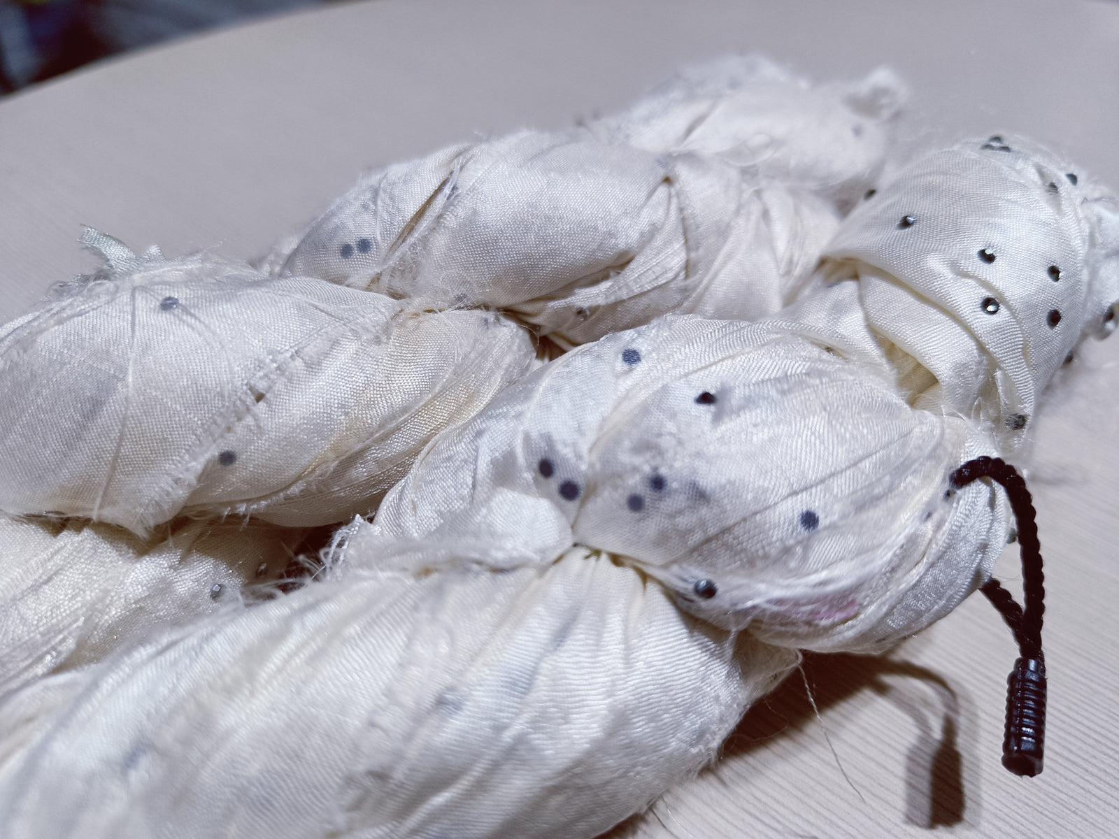 Embellished Recycled Sari silk Ribbon is the by-product of colorful saris that women wear in India.  The vibrant colors and unique texture of these silk fabric, the sari silk ribbons are inspirational to designers, knitters, and artisans.  recycled sari ribbon,  recycled sari silk ribbon yarn, recycled sari ribbon,  recycled ribbon, recycled silk,  recycled sari silk ribbon, ribbon yarn,  sari silk yarn, sari silk ribbon yarn, recycle sari silk