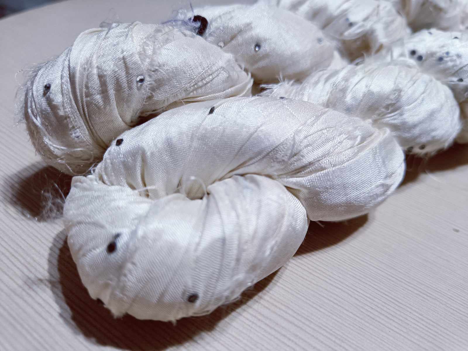 Embellished Recycled Sari silk Ribbon is the by-product of colorful saris that women wear in India.  The vibrant colors and unique texture of these silk fabric, the sari silk ribbons are inspirational to designers, knitters, and artisans.  recycled sari ribbon,  recycled sari silk ribbon yarn, recycled sari ribbon,  recycled ribbon, recycled silk,  recycled sari silk ribbon, ribbon yarn,  sari silk yarn, sari silk ribbon yarn, recycle sari silk