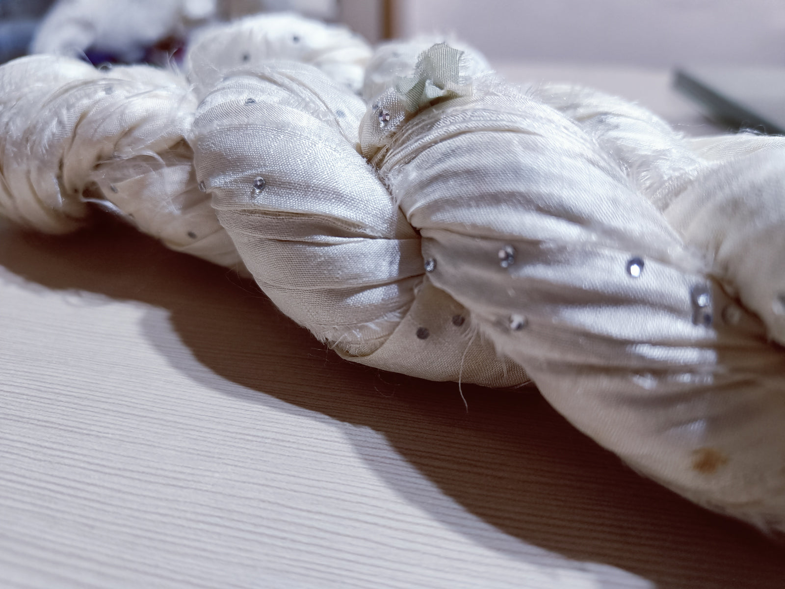 Embellished Recycled Sari silk Ribbon is the by-product of colorful saris that women wear in India.  The vibrant colors and unique texture of these silk fabric, the sari silk ribbons are inspirational to designers, knitters, and artisans.  recycled sari ribbon,  recycled sari silk ribbon yarn, recycled sari ribbon,  recycled ribbon, recycled silk,  recycled sari silk ribbon, ribbon yarn,  sari silk yarn, sari silk ribbon yarn, recycle sari silk