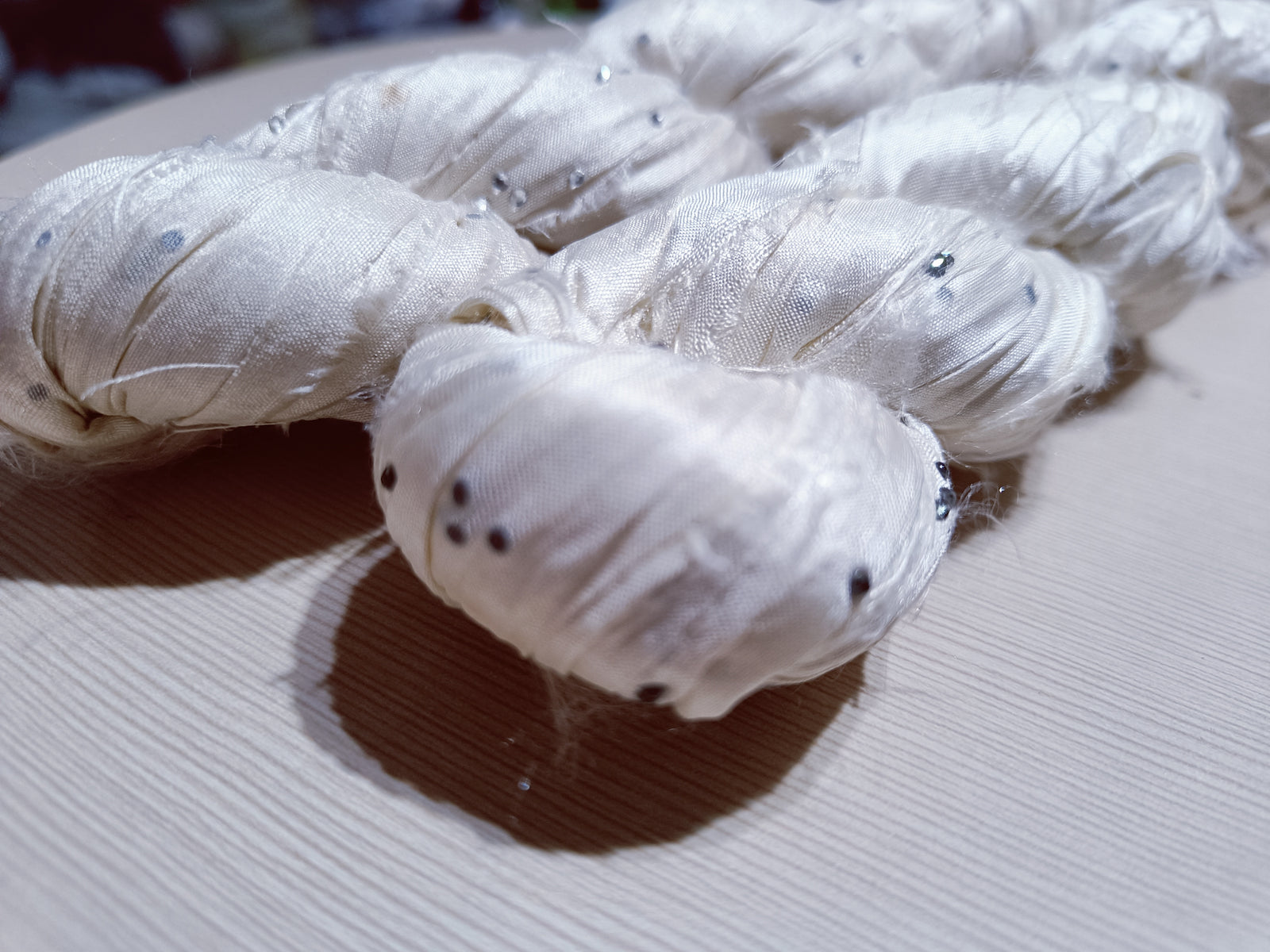 Embellished Recycled Sari silk Ribbon is the by-product of colorful saris that women wear in India.  The vibrant colors and unique texture of these silk fabric, the sari silk ribbons are inspirational to designers, knitters, and artisans.  recycled sari ribbon,  recycled sari silk ribbon yarn, recycled sari ribbon,  recycled ribbon, recycled silk,  recycled sari silk ribbon, ribbon yarn,  sari silk yarn, sari silk ribbon yarn, recycle sari silk