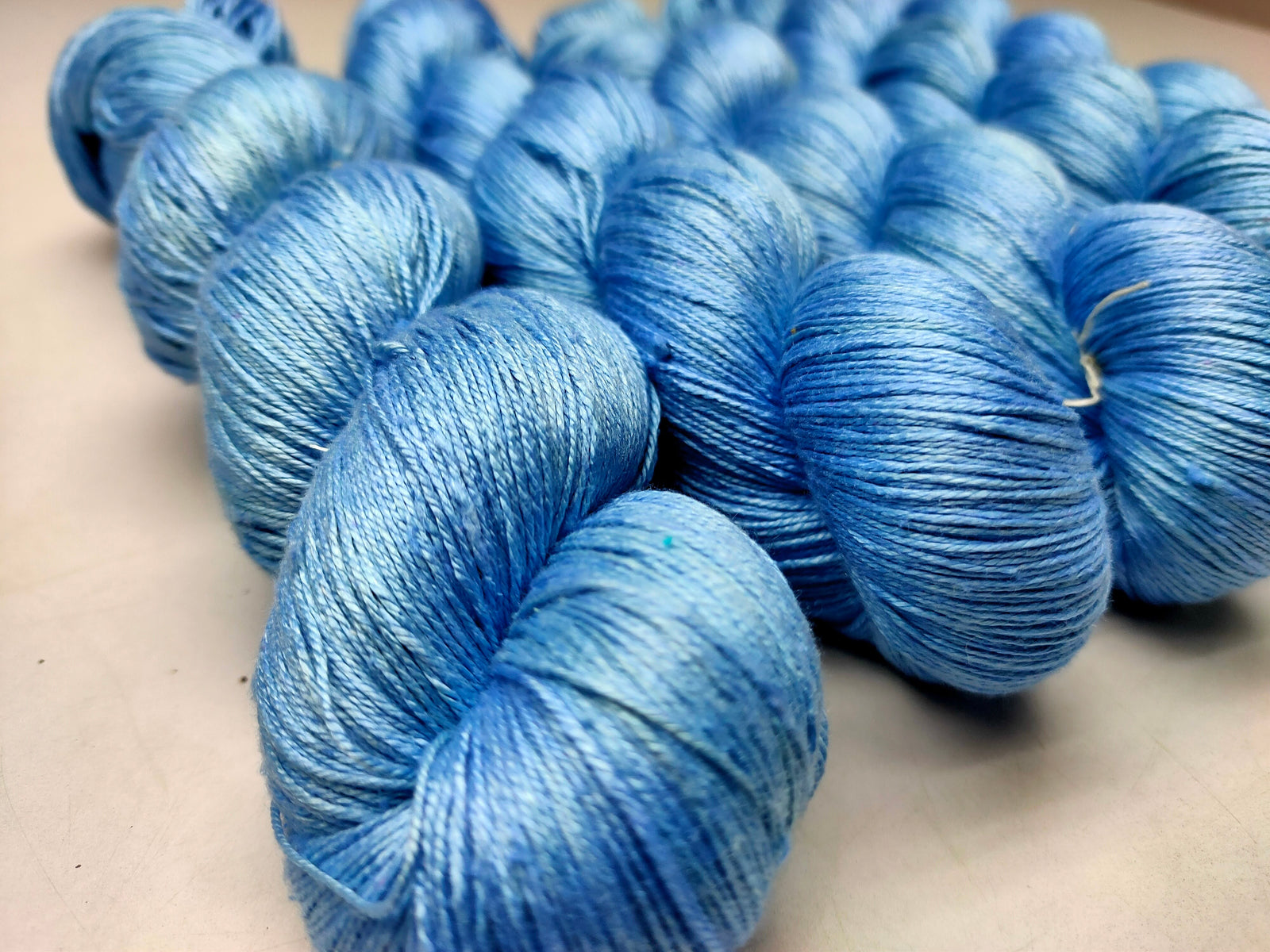 Mulberry Silk yarn (600 mts in 100gram) is a unique Silk Yarn ideal for Knitting. Mulberry Silk is very soft and shiny. It is Sock weight and is directly spun from the premium Mulberry Silk Tops. It is a yarn of Natural Protein Fiber. Mulberry Silk Yarn has compact structure, evenness, clean appearance, elegant luster, Good moisture-absorbing capability, good strength and elongation, with fine and soft fibers. It is useful for Weaving and Knitting.