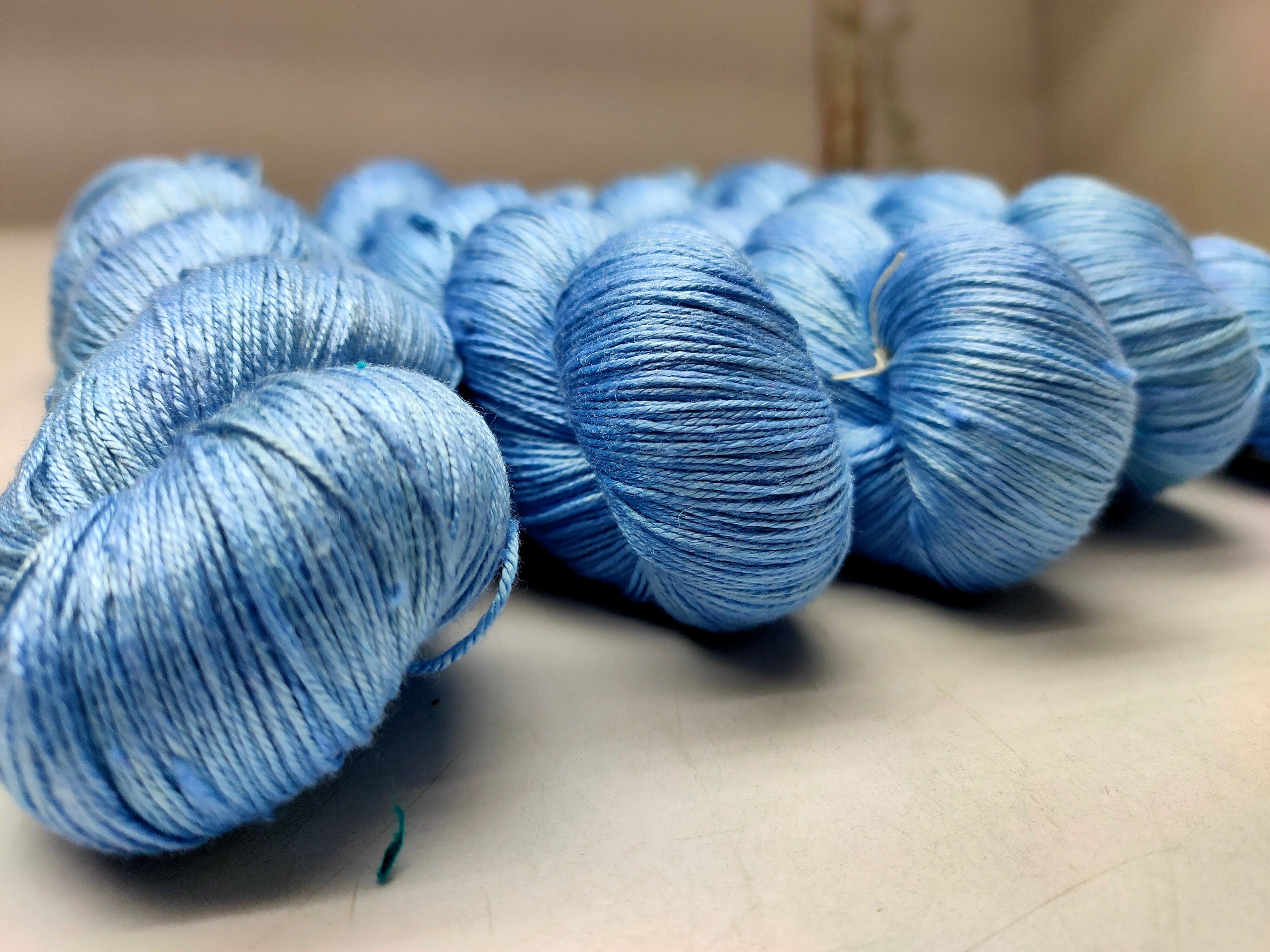 Mulberry Silk yarn (600 mts in 100gram) is a unique Silk Yarn ideal for Knitting. Mulberry Silk is very soft and shiny. It is Sock weight and is directly spun from the premium Mulberry Silk Tops. It is a yarn of Natural Protein Fiber. Mulberry Silk Yarn has compact structure, evenness, clean appearance, elegant luster, Good moisture-absorbing capability, good strength and elongation, with fine and soft fibers. It is useful for Weaving and Knitting.