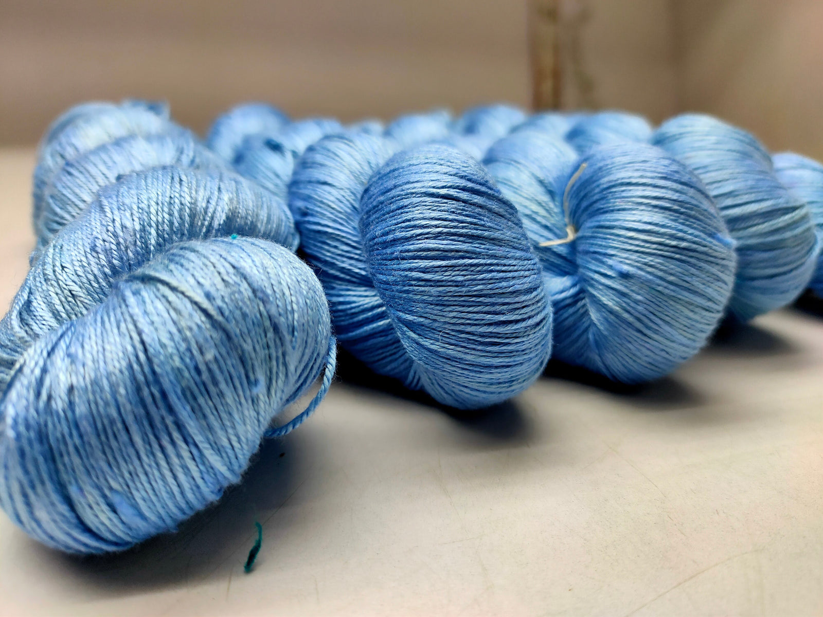 Mulberry Silk yarn (600 mts in 100gram) is a unique Silk Yarn ideal for Knitting. Mulberry Silk is very soft and shiny. It is Sock weight and is directly spun from the premium Mulberry Silk Tops. It is a yarn of Natural Protein Fiber. Mulberry Silk Yarn has compact structure, evenness, clean appearance, elegant luster, Good moisture-absorbing capability, good strength and elongation, with fine and soft fibers. It is useful for Weaving and Knitting.