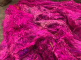 Sari silk batts soft fiber | pink | silkrouteindia  - Recycled Sari Silk waste Batts are the strongest natural fibers and is spun into a wonderful yarn used for knitting and weaving! The Silk Batts have a lovely draping quality. The batts is a smooth filament and the fabric out of it is comfortable against the skin. Silk is a natural protein fiber. Silk Batts are well known for its shine, lustre and tensile strength. This fiber is recycled and carded or processed into roving or batts form.
