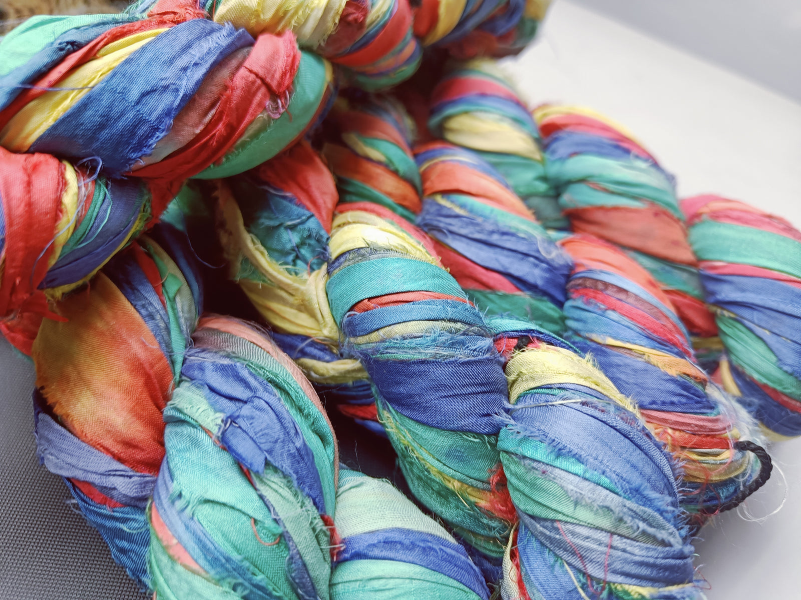 recycle sari ribbon, recycled sari ribbon,recycled sari silk ribbon,   recycled sari silk ribbon yarn, recycled sari ribbon,  recycled ribbon, recycled silk,  recycled sari silk ribbon, sari silk yarn