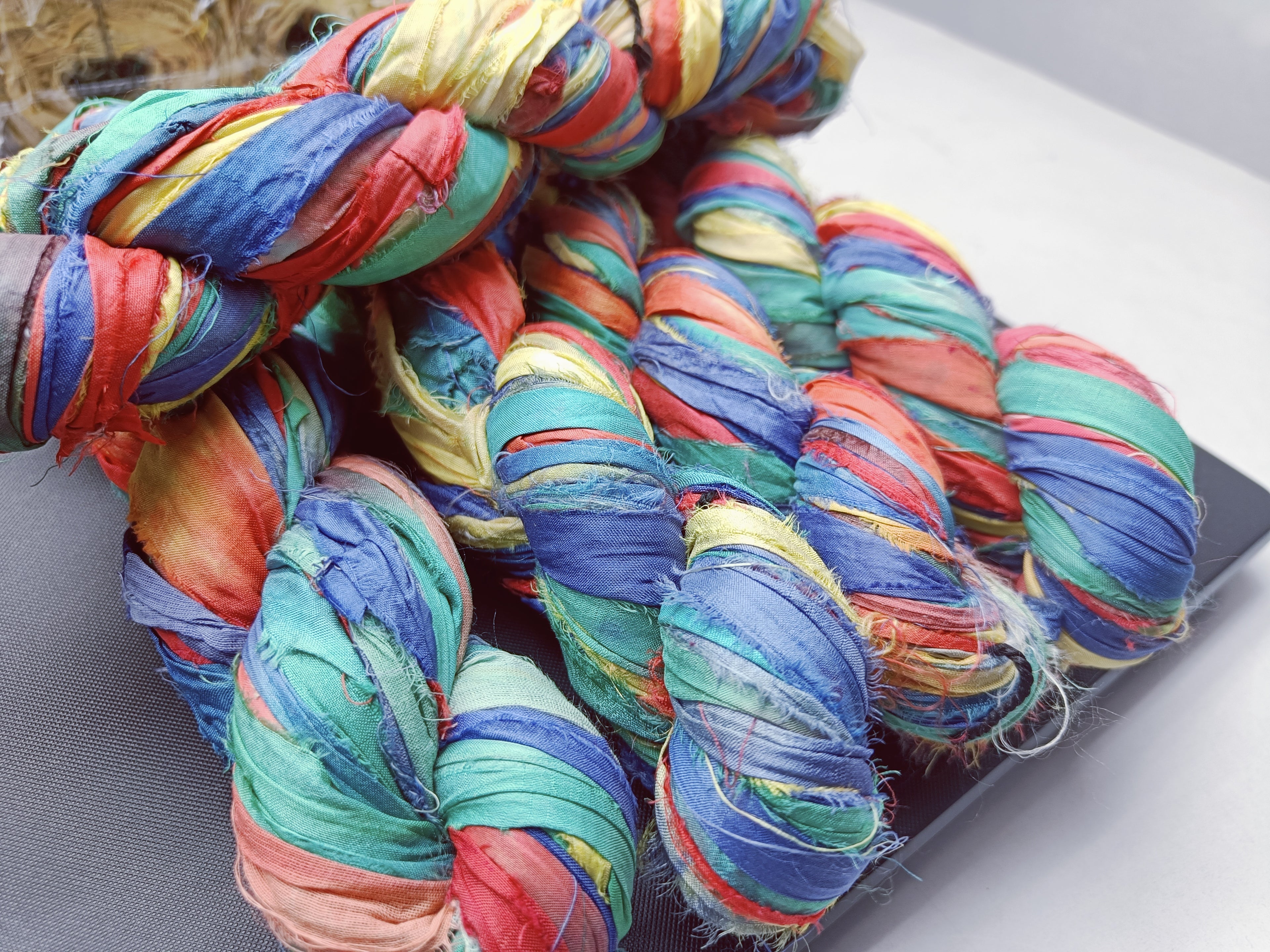 recycle sari ribbon, recycled sari ribbon,recycled sari silk ribbon,   recycled sari silk ribbon yarn, recycled sari ribbon,  recycled ribbon, recycled silk,  recycled sari silk ribbon, sari silk yarn