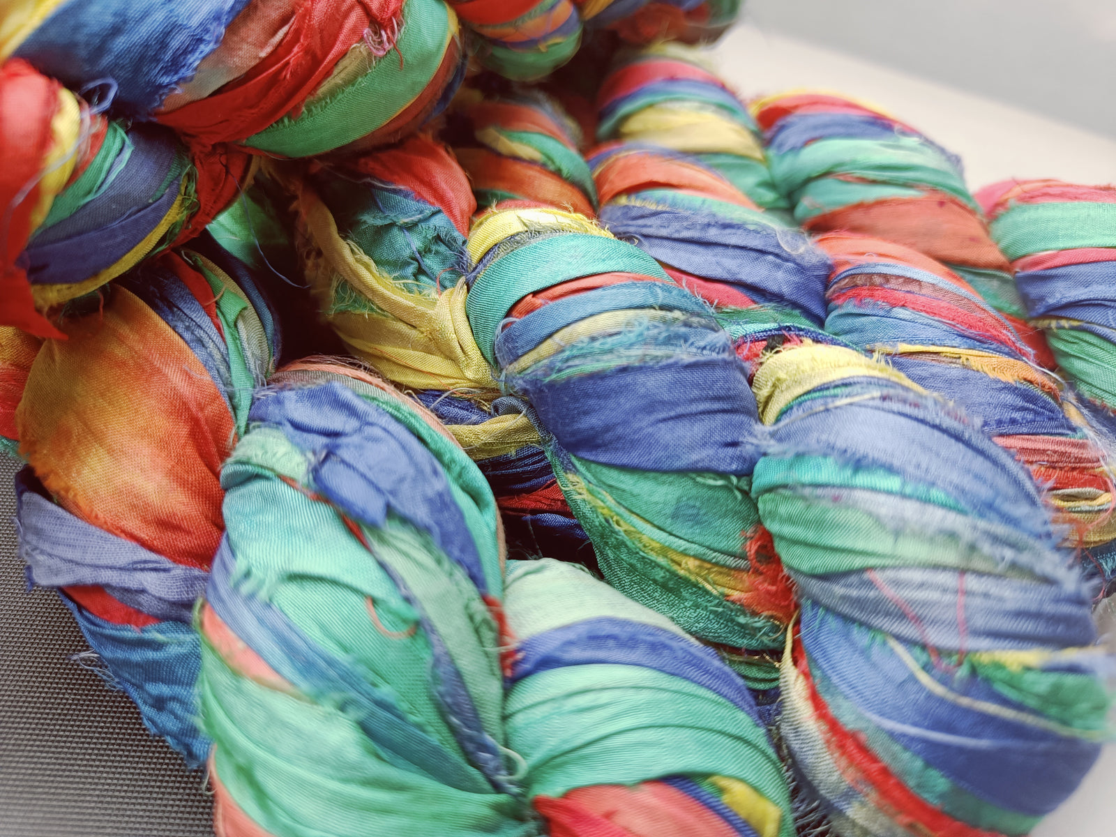 recycle sari ribbon, recycled sari ribbon,recycled sari silk ribbon,   recycled sari silk ribbon yarn, recycled sari ribbon,  recycled ribbon, recycled silk,  recycled sari silk ribbon, sari silk yarn