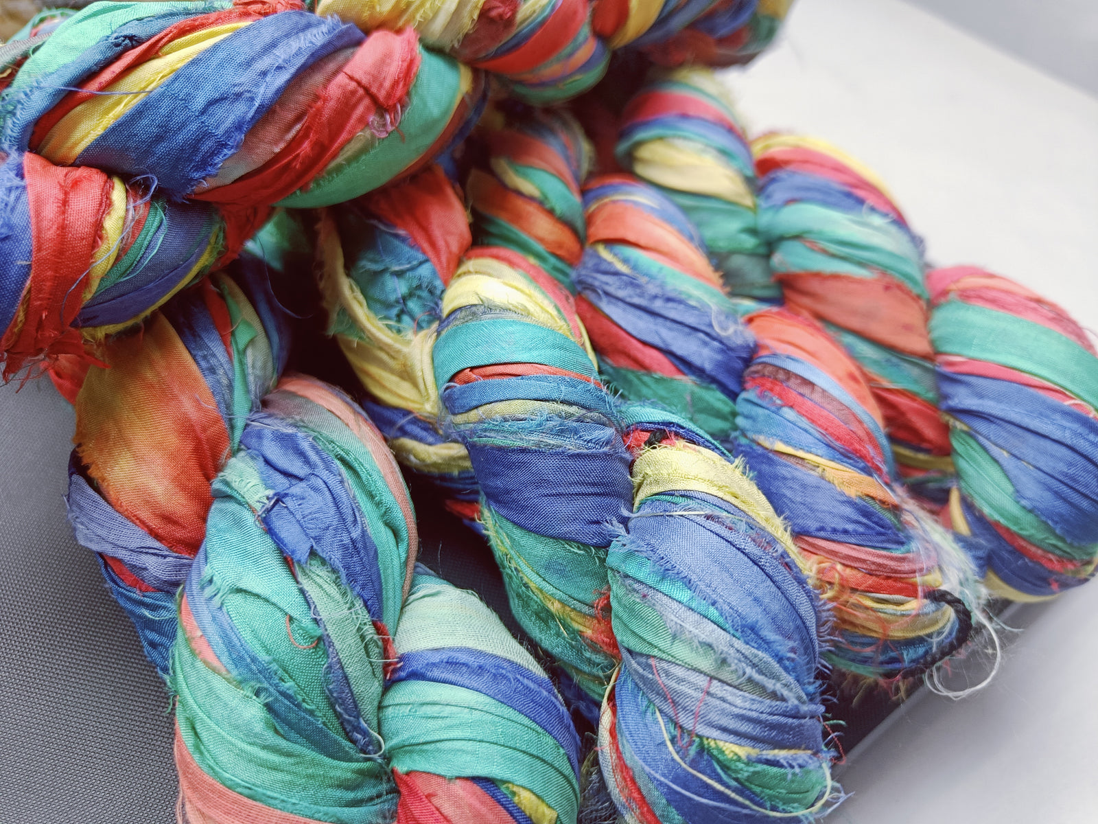 recycle sari ribbon, recycled sari ribbon,recycled sari silk ribbon,   recycled sari silk ribbon yarn, recycled sari ribbon,  recycled ribbon, recycled silk,  recycled sari silk ribbon, sari silk yarn