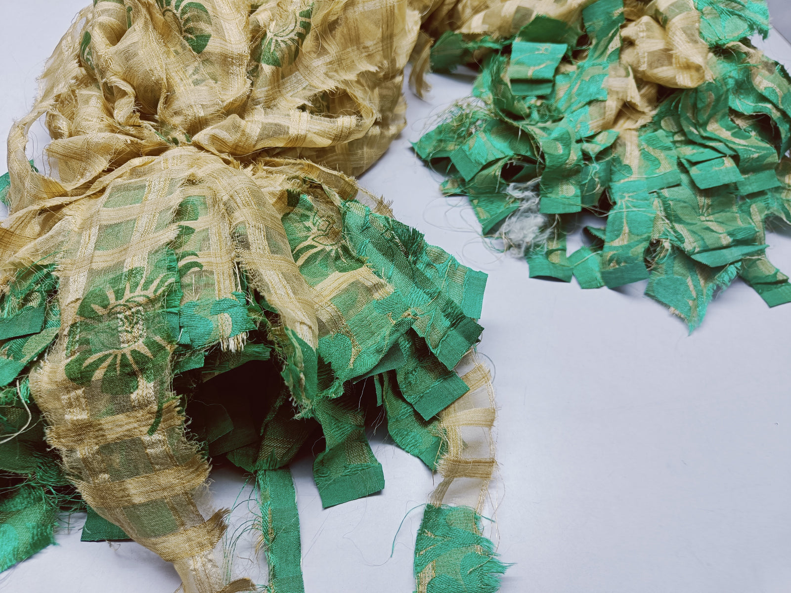 Reclaimed Indian Sari Stripe is the by-product of colorful saris that women wear in India. It is the loose ends of saris collected from industrial mills in India that is torn in stripes to make beautiful and colorful stripes. The vibrant colors and unique texture of these sari stripe, the sari Stripe are inspirational to designers, knitters, and artisans. The popularity of Sari Stripe has extended beyond India and has created an empowering cottage industry primarily benefiting women.