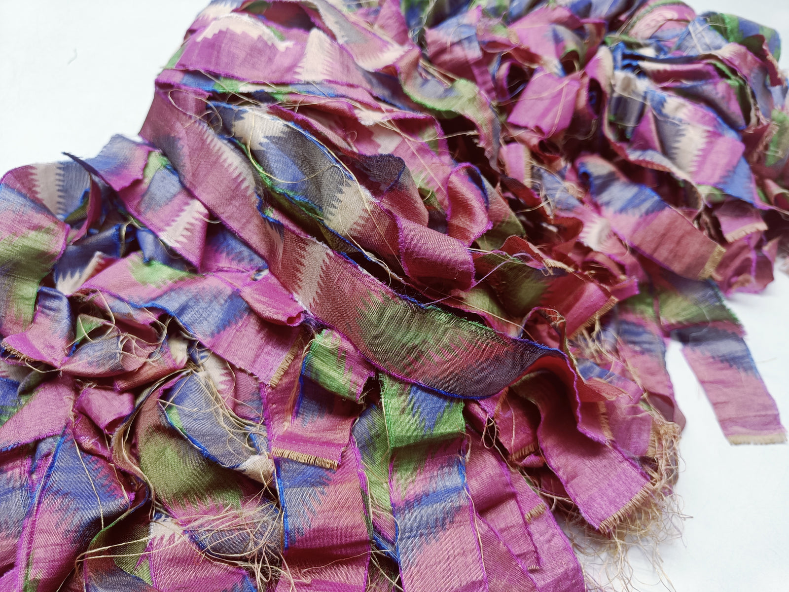 Reclaimed Indian Sari Stripe is the by-product of colorful saris that women wear in India. It is the loose ends of saris collected from industrial mills in India that is torn in stripes to make beautiful and colorful stripes. The vibrant colors and unique texture of these sari stripe, the sari Stripe are inspirational to designers, knitters, and artisans. The popularity of Sari Stripe has extended beyond India and has created an empowering cottage industry primarily benefiting women.