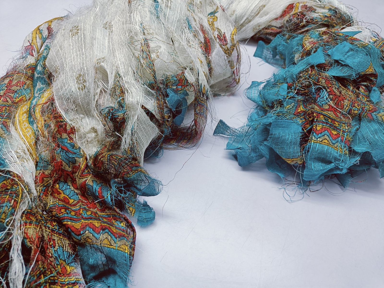 Reclaimed Indian Sari Stripe is the by-product of colorful saris that women wear in India. It is the loose ends of saris collected from industrial mills in India that is torn in stripes to make beautiful and colorful stripes. The vibrant colors and unique texture of these sari stripe, the sari Stripe are inspirational to designers, knitters, and artisans. The popularity of Sari Stripe has extended beyond India and has created an empowering cottage industry primarily benefiting women.