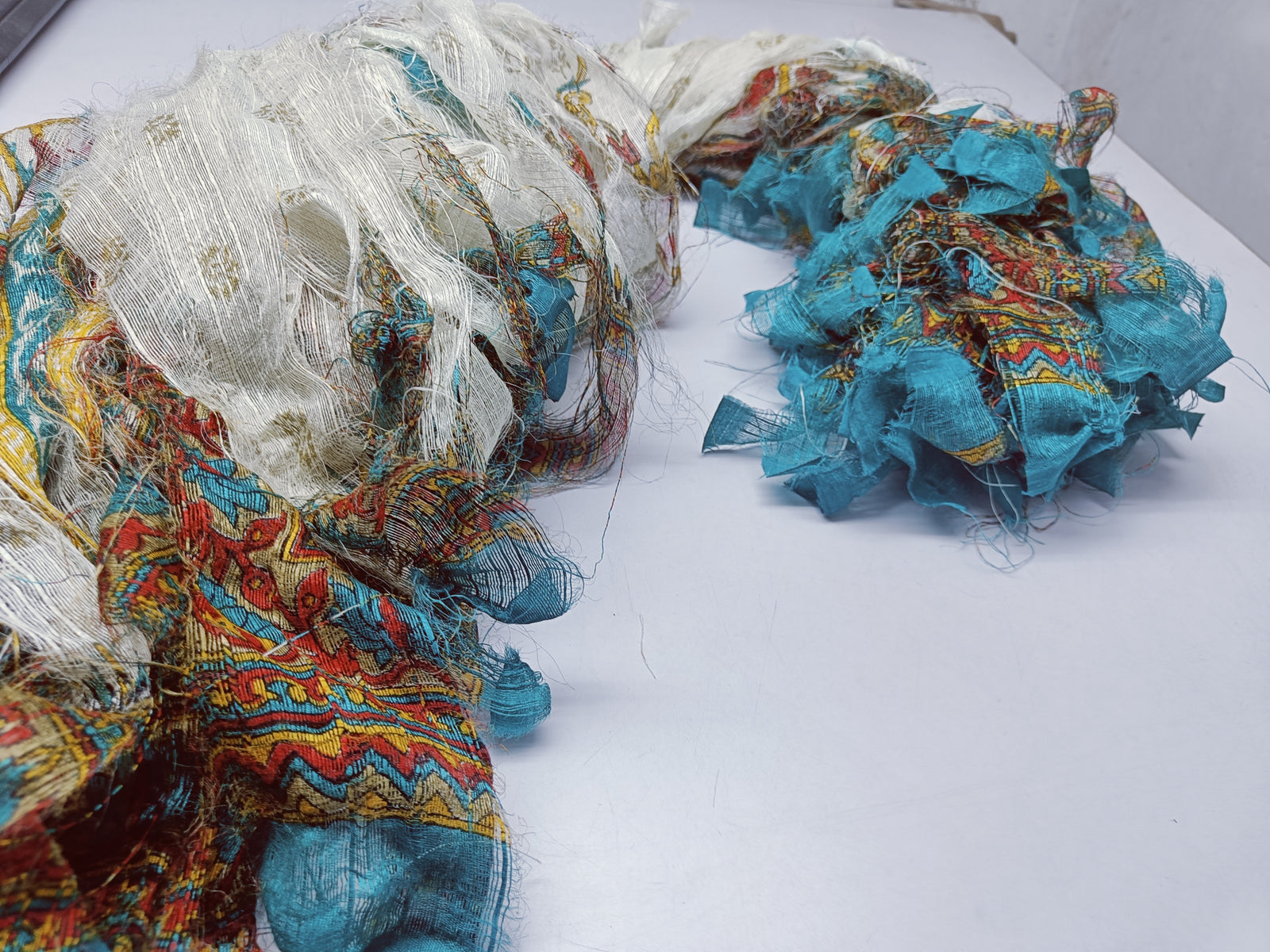 Reclaimed Indian Sari Stripe is the by-product of colorful saris that women wear in India. It is the loose ends of saris collected from industrial mills in India that is torn in stripes to make beautiful and colorful stripes. The vibrant colors and unique texture of these sari stripe, the sari Stripe are inspirational to designers, knitters, and artisans. The popularity of Sari Stripe has extended beyond India and has created an empowering cottage industry primarily benefiting women.