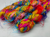 Recycled Yarn Big Candy is available with hairy appearance of Sari Thrums or with multitude of colors. We fabricate this Big Candy from the Sari Thrums of silk production units. The Yarn, available with us, is hand spun into bright hanks which is suitable for number of Handicrafts applications. 