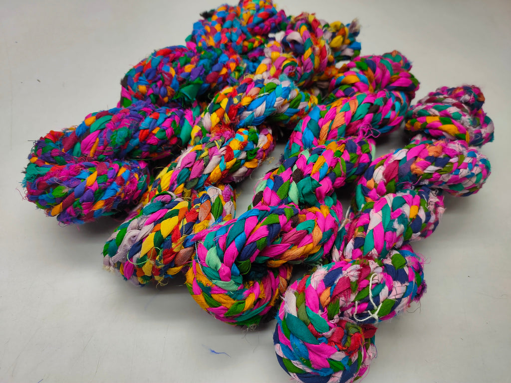 Braided yarn is made of pure silk and is approximately an inch wide through out. Due to its handmade nature there might occasionally be variations in width. When silk fabric is cut and made into saris, wraps, and veils, there is always a bit left over. Rather than throw that waste fiber into the trash, it has been made into a beautiful, unique, soft yarn..!! Direct from India, this yarn is a truly recycled product. It is a bulky weight and is soft and easy to knit or crochet.