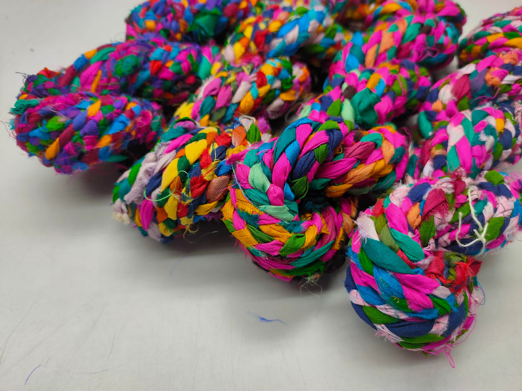 Braided yarn is made of pure silk and is approximately an inch wide through out. Due to its handmade nature there might occasionally be variations in width. When silk fabric is cut and made into saris, wraps, and veils, there is always a bit left over. Rather than throw that waste fiber into the trash, it has been made into a beautiful, unique, soft yarn..!! Direct from India, this yarn is a truly recycled product. It is a bulky weight and is soft and easy to knit or crochet.
