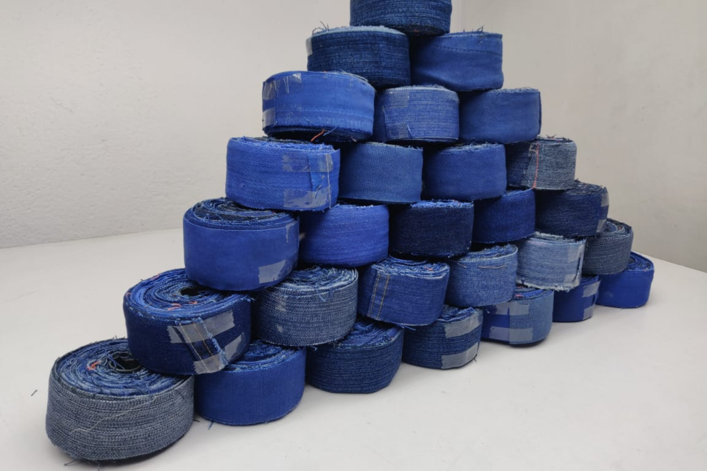 Recycled Denim Ribbon/ Denim Cotton Ribbon is the by-product of jeans wear in India. Are you planning to buy Denim Ribbon Online? The jeans are washed and then torn in stripes and sewn end to end to make beautiful.