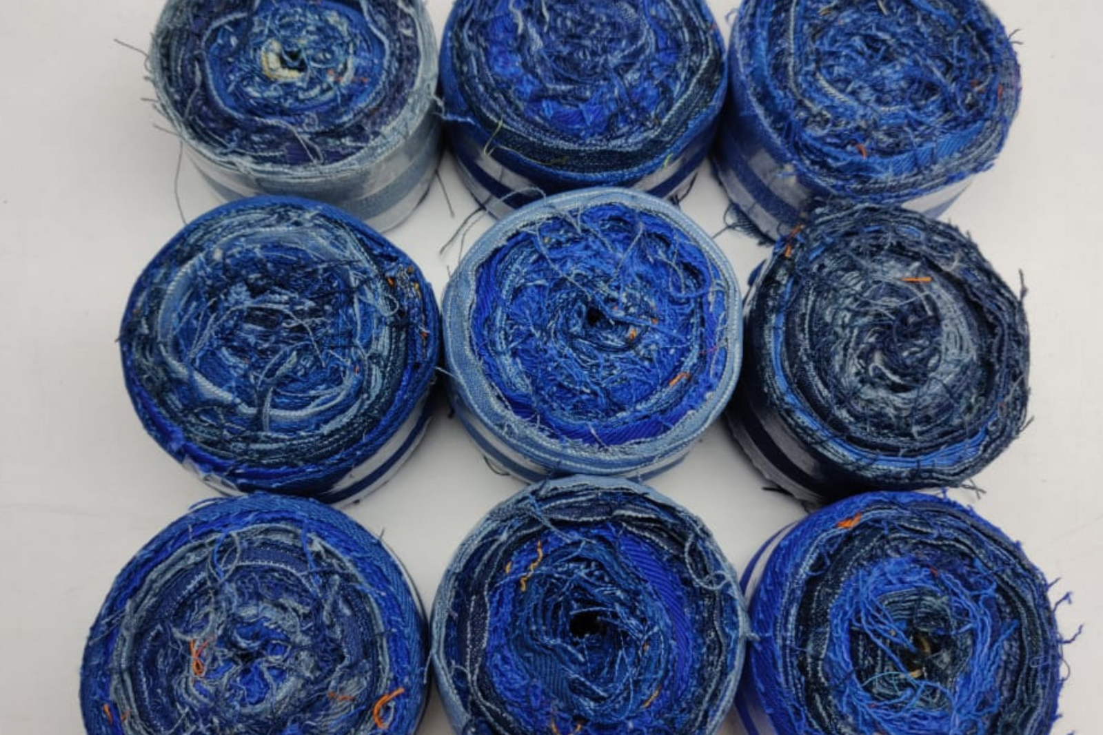 Recycled Denim Ribbon/ Denim Cotton Ribbon is the by-product of jeans wear in India. Are you planning to buy Denim Ribbon Online? The jeans are washed and then torn in stripes and sewn end to end to make beautiful.