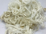 Recycled Linen Yarn Waste are the leftover or excessive warp/ weft thread on handlooms/ powerloom, to be specific the byproduct linen from industrial Linen weaving unit in India. There’s no dye lot on recycled Linen Fiber. These recycled fiber waste are the remnants of traditionally crafted Indian Linen yarn and are extensively used in making hats, mittens & hand scarves. Each lot has distinct colors, as its a mixed lot of white, natural white, off White or undy