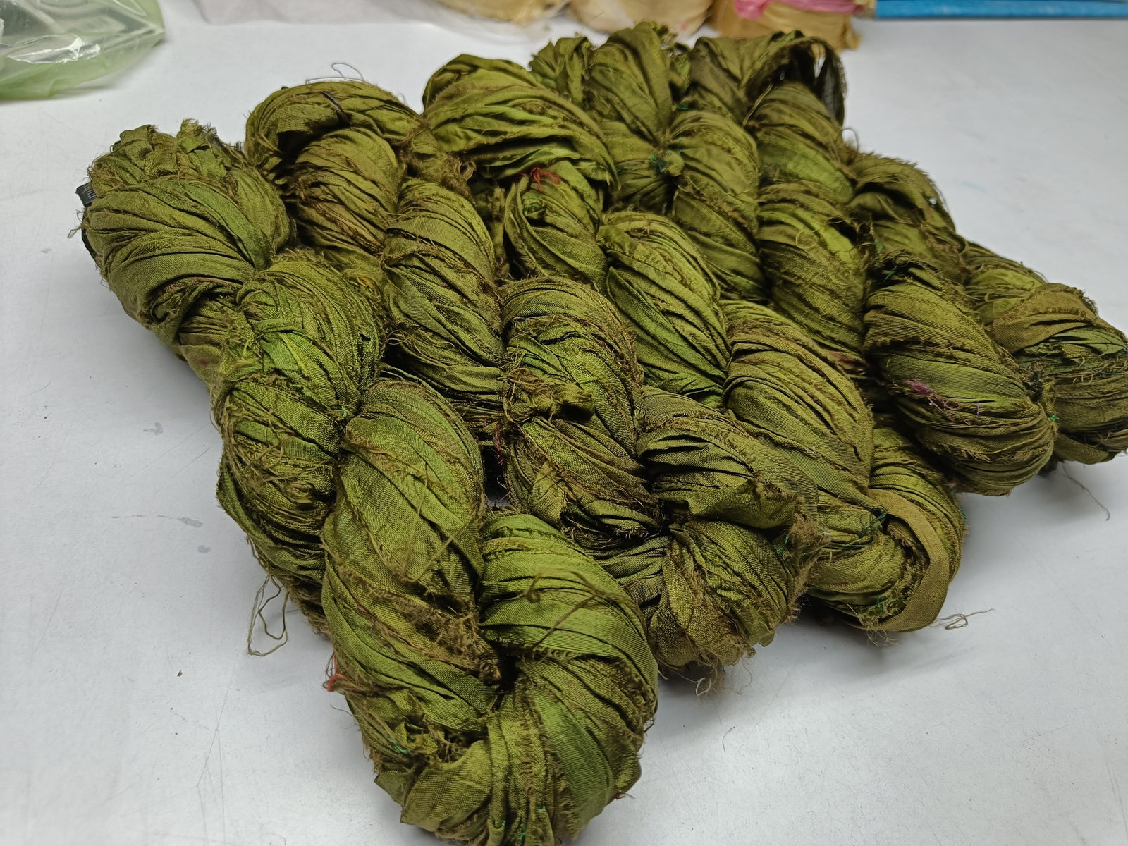 Recycled Sari silk Ribbon is the by-product of colorful saris that women wear in India. It is the loose ends of saris collected from industrial mills in India that is torn in stripes and sewn end to end to make beautiful and colorful ribbons. 