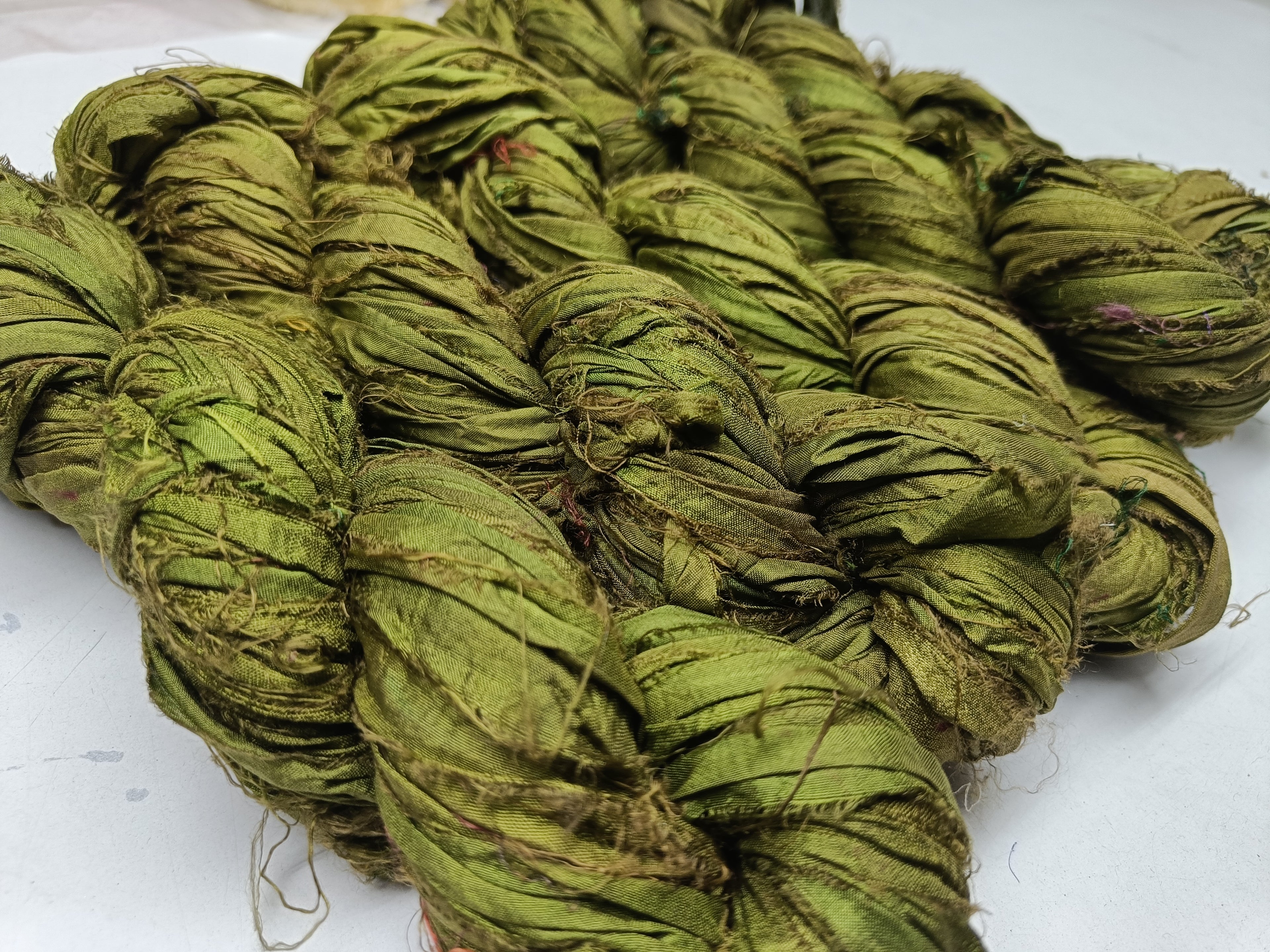 Recycled Sari silk Ribbon is the by-product of colorful saris that women wear in India. It is the loose ends of saris collected from industrial mills in India that is torn in stripes and sewn end to end to make beautiful and colorful ribbons. 