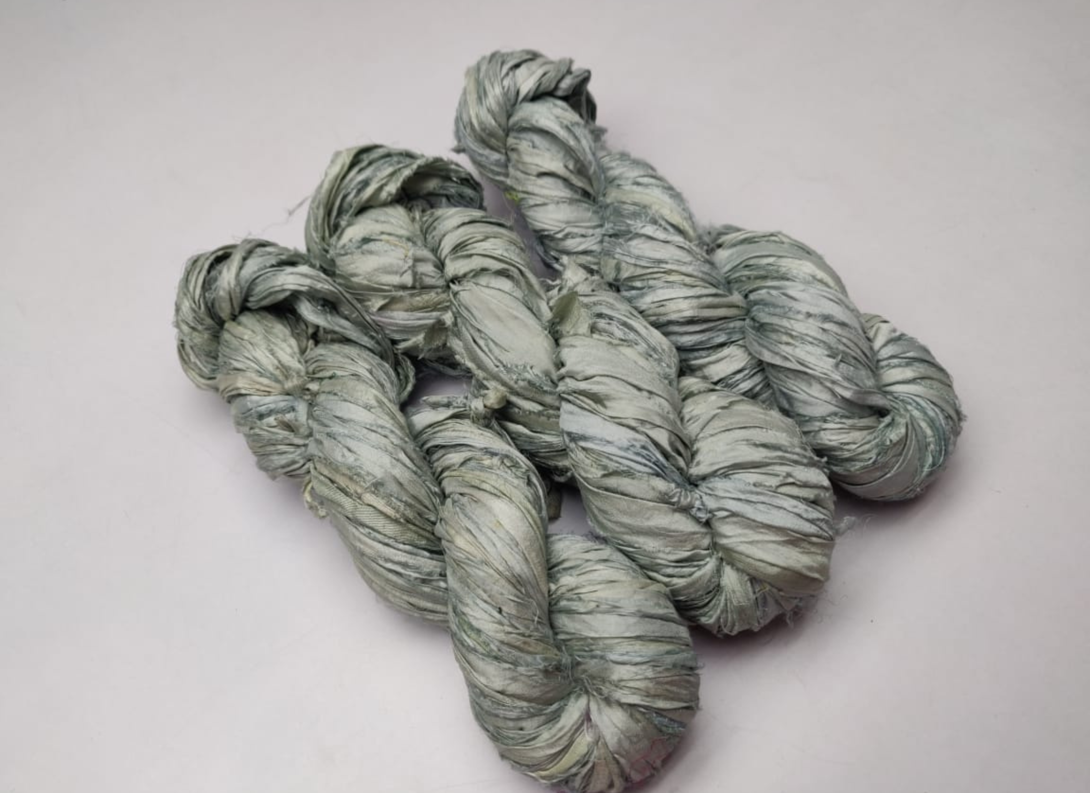 Sari silk Ribbon is the by-product of colorful saris that women wear in India. It is the loose ends of saris collected from industrial mills in India that is torn in stripes and sewn end to end to make beautiful and colorful ribbon