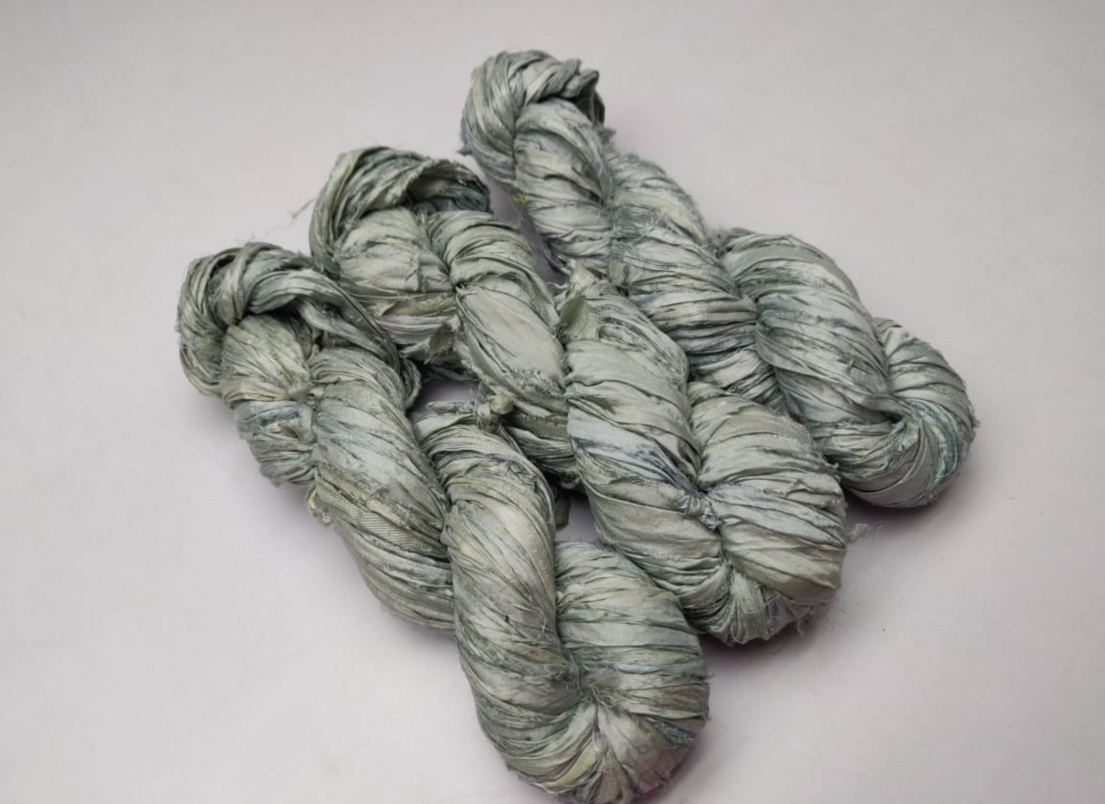 Sari silk Ribbon is the by-product of colorful saris that women wear in India. It is the loose ends of saris collected from industrial mills in India that is torn in stripes and sewn end to end to make beautiful and colorful ribbon