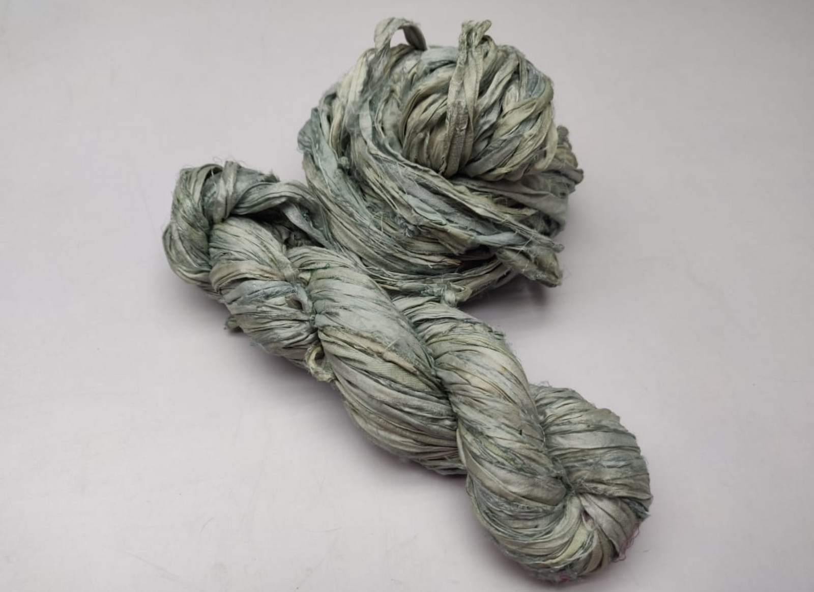 Sari silk Ribbon is the by-product of colorful saris that women wear in India. It is the loose ends of saris collected from industrial mills in India that is torn in stripes and sewn end to end to make beautiful and colorful ribbon