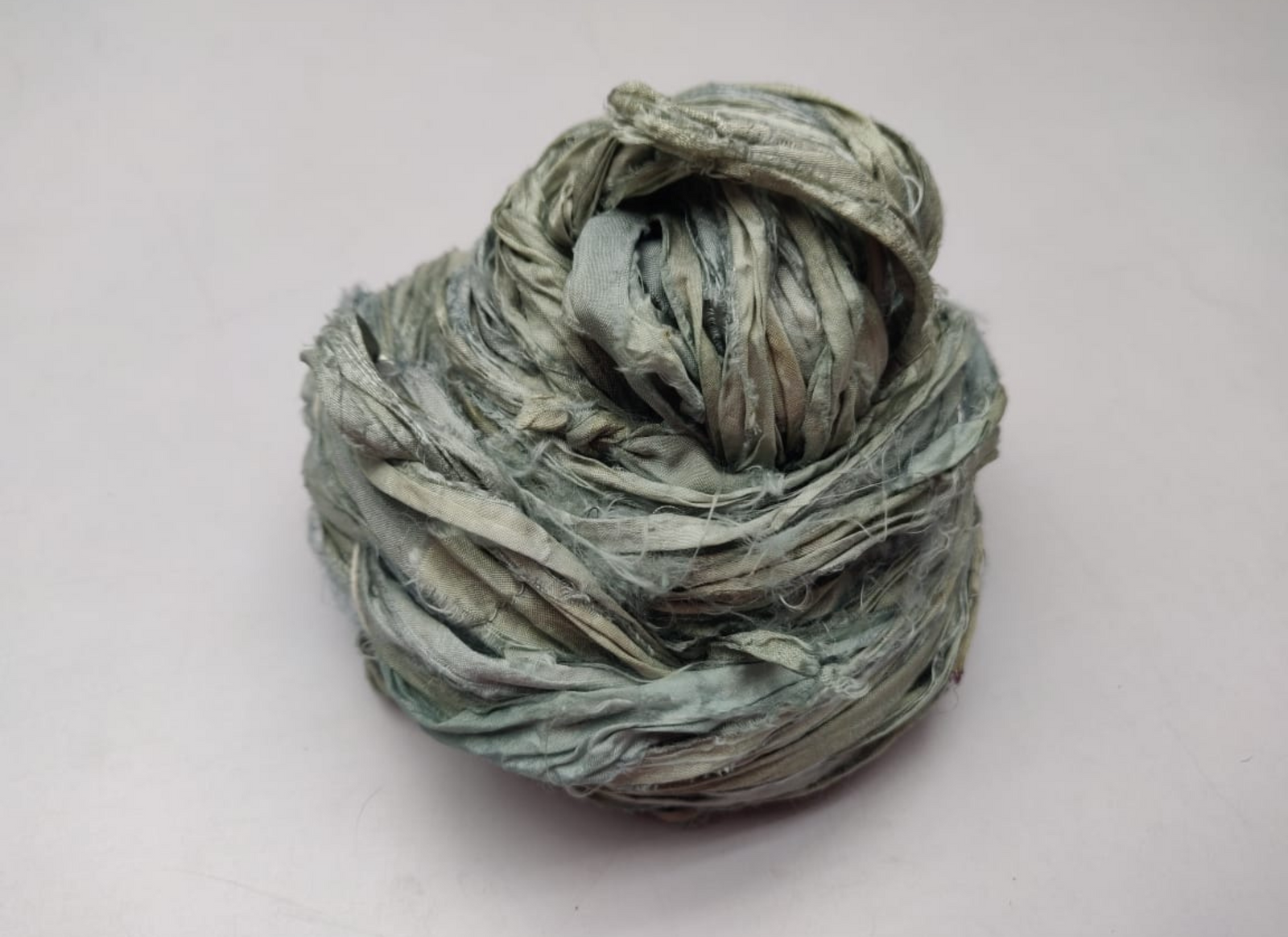 Sari silk Ribbon is the by-product of colorful saris that women wear in India. It is the loose ends of saris collected from industrial mills in India that is torn in stripes and sewn end to end to make beautiful and colorful ribbon