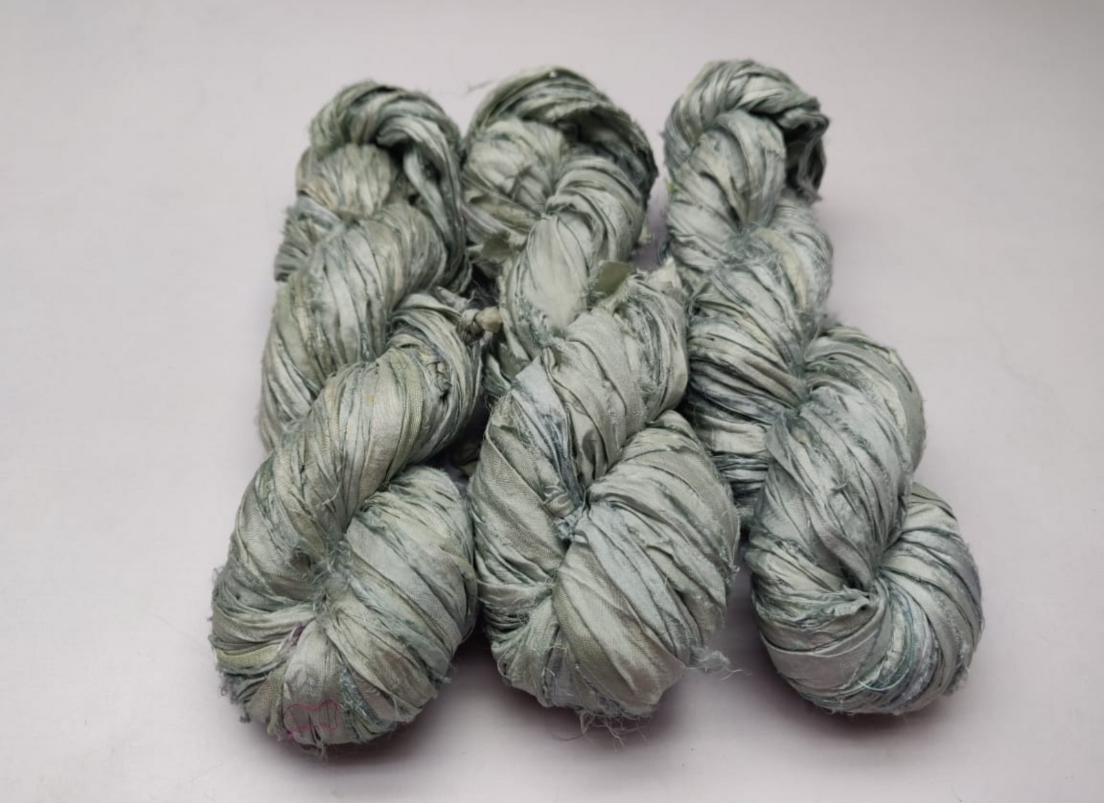 Sari silk Ribbon is the by-product of colorful saris that women wear in India. It is the loose ends of saris collected from industrial mills in India that is torn in stripes and sewn end to end to make beautiful and colorful ribbon