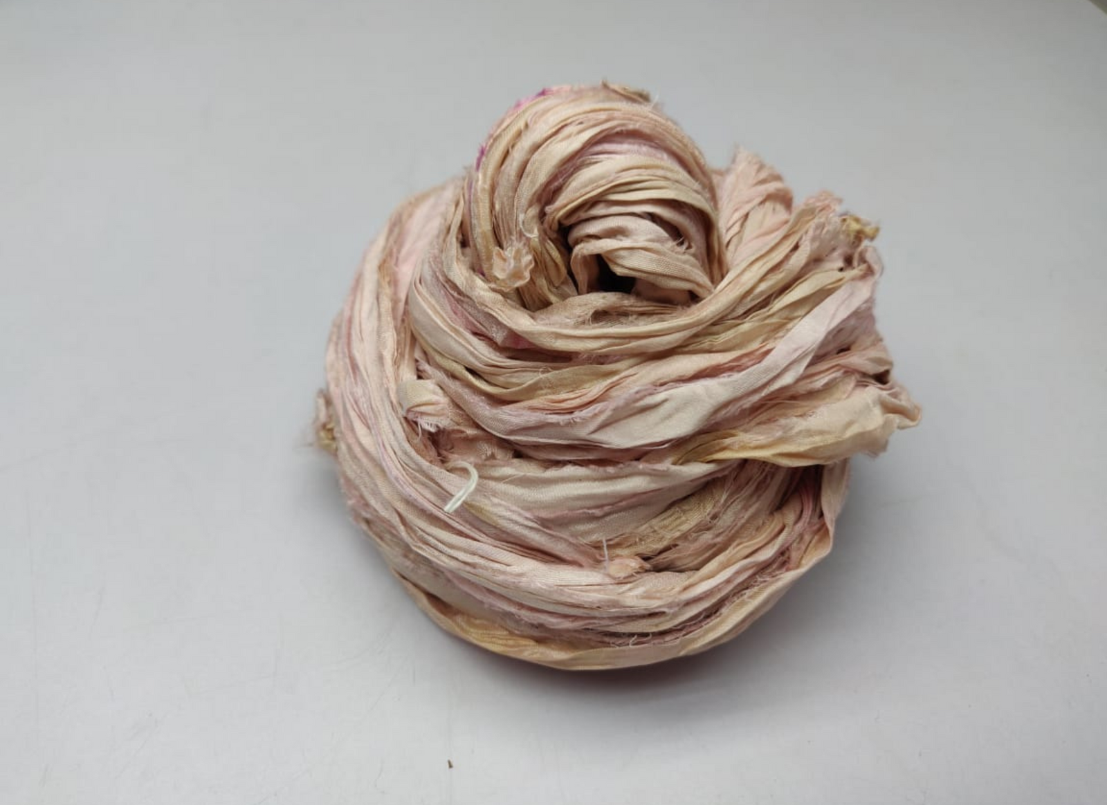 Sari silk Ribbon is the by-product of colorful saris that women wear in India. It is the loose ends of saris collected from industrial mills in India that is torn in stripes and sewn end to end to make beautiful and colorful ribbon