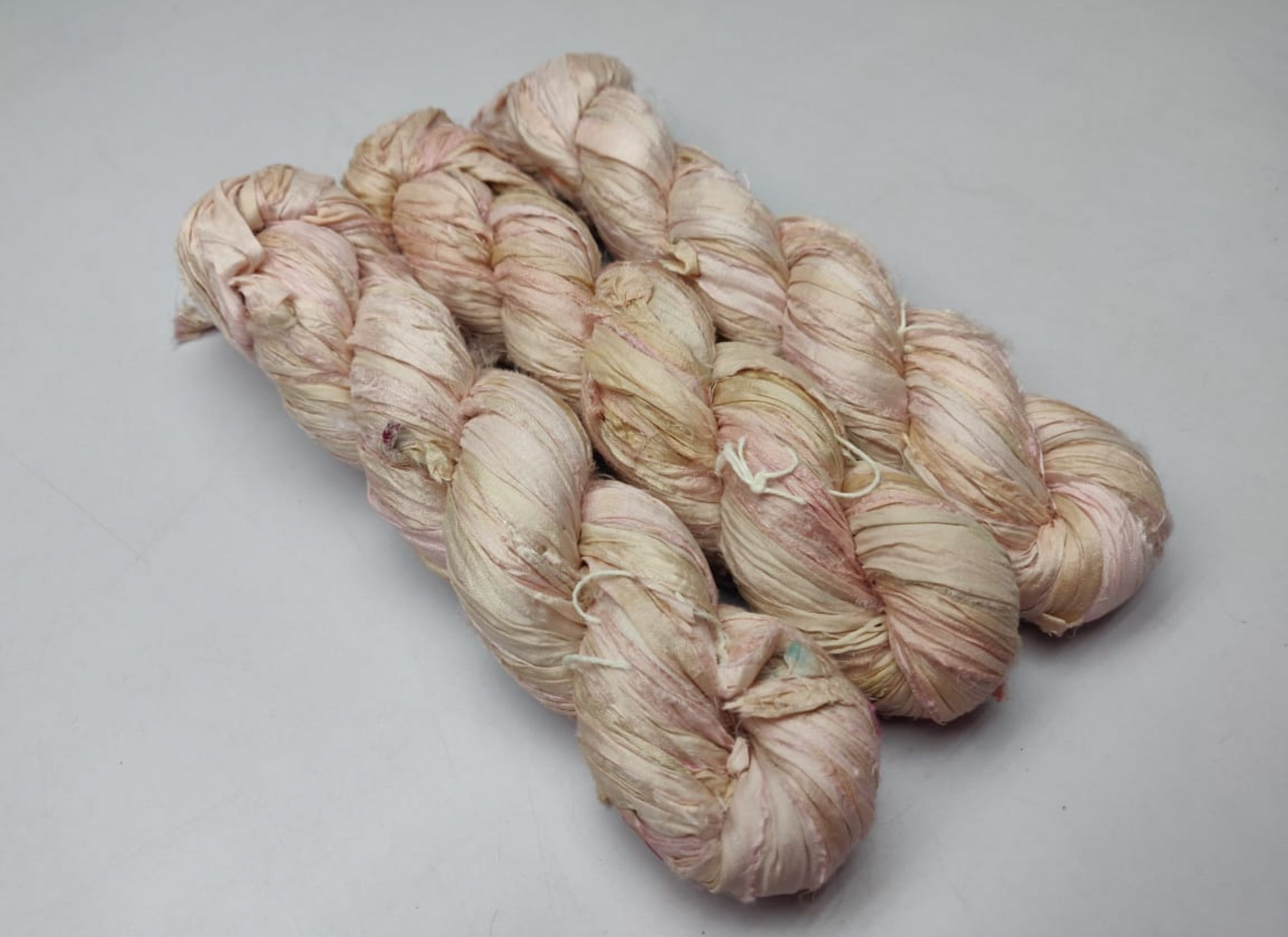 Sari silk Ribbon is the by-product of colorful saris that women wear in India. It is the loose ends of saris collected from industrial mills in India that is torn in stripes and sewn end to end to make beautiful and colorful ribbon - SilkRouteIndia