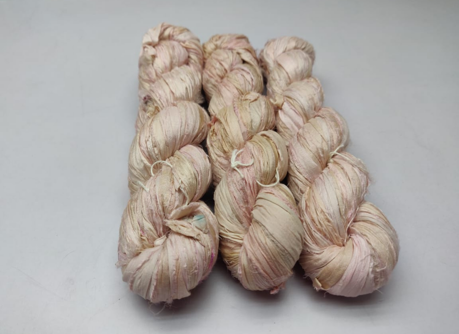 Sari silk Ribbon is the by-product of colorful saris that women wear in India. It is the loose ends of saris collected from industrial mills in India that is torn in stripes and sewn end to end to make beautiful and colorful ribbon