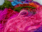 Recycled Sari Silk Fibers is available in assorted colorways, and is open status. They are the strongest natural fibers and are spun into a wonderful yarn used for knitting and weaving! The Silk fabrics have a lovely draping quality.