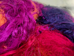 Recycled Sari Silk Fibers is available in assorted colorways, and is open status. They are the strongest natural fibers and are spun into a wonderful yarn used for knitting and weaving! The Silk fabrics have a lovely draping quality.
