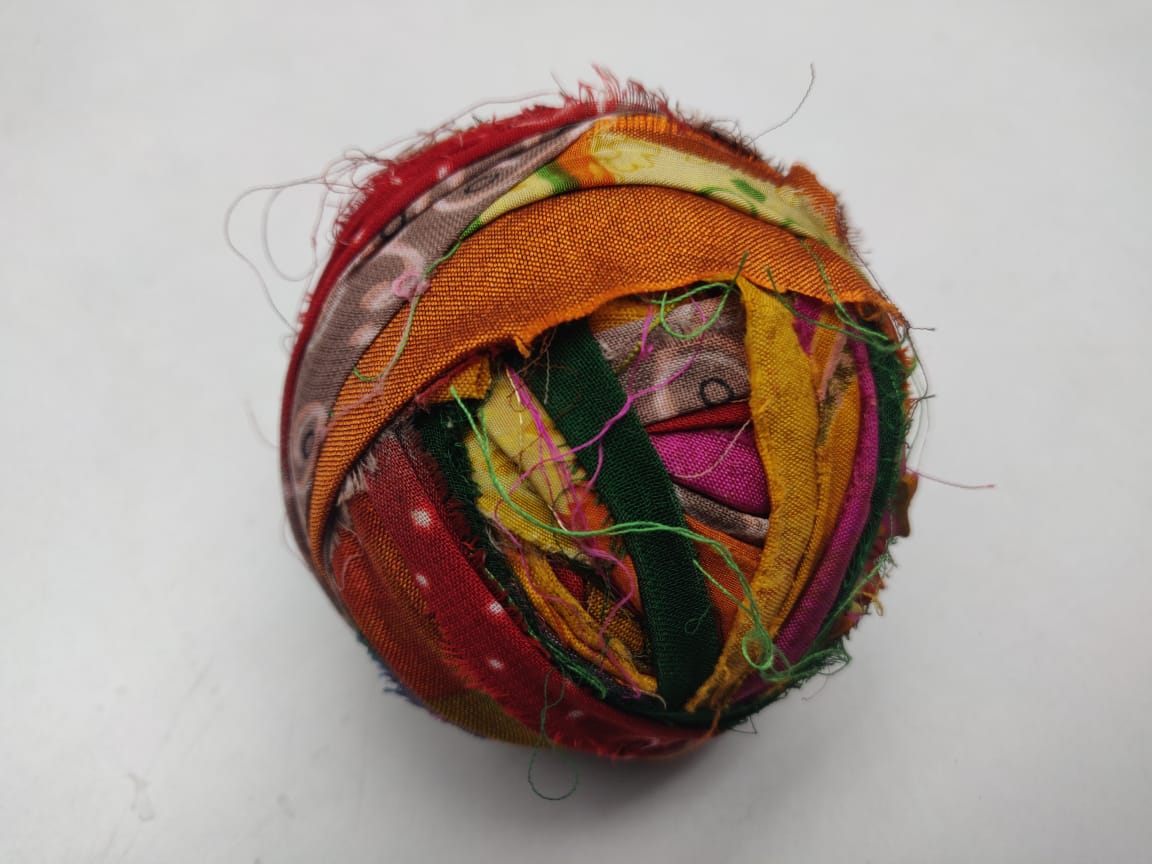 Recycled Sari silk Ribbon-Rolls is the by-product of colorful saris that women wear in India. It is the loose ends of saris collected from industrial mills in India that is torn in stripes and sewn end to end to make beautiful and col