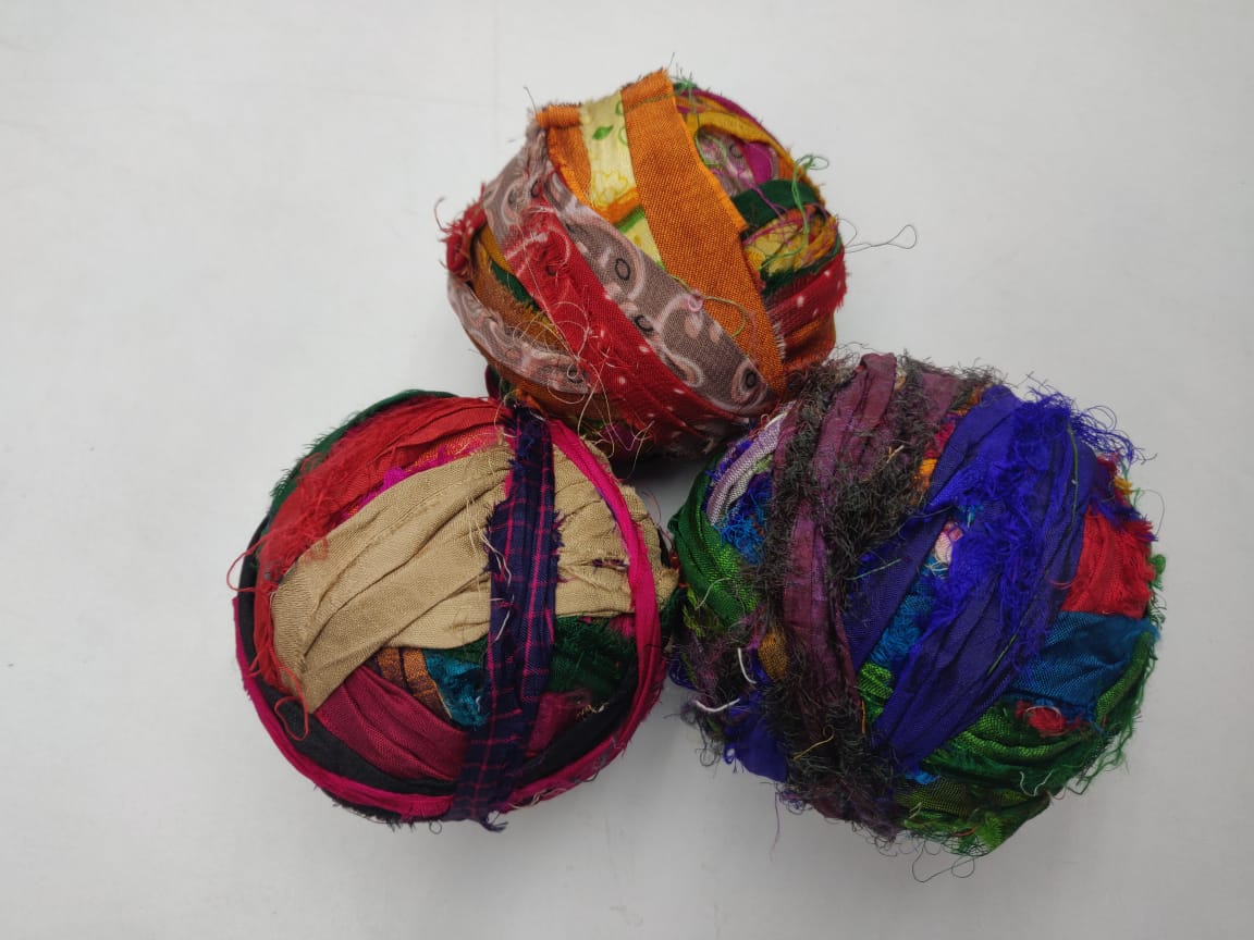 Recycled Sari silk Ribbon-Rolls is the by-product of colorful saris that women wear in India. It is the loose ends of saris collected from industrial mills in India that is torn in stripes and sewn end to end to make beautiful and col