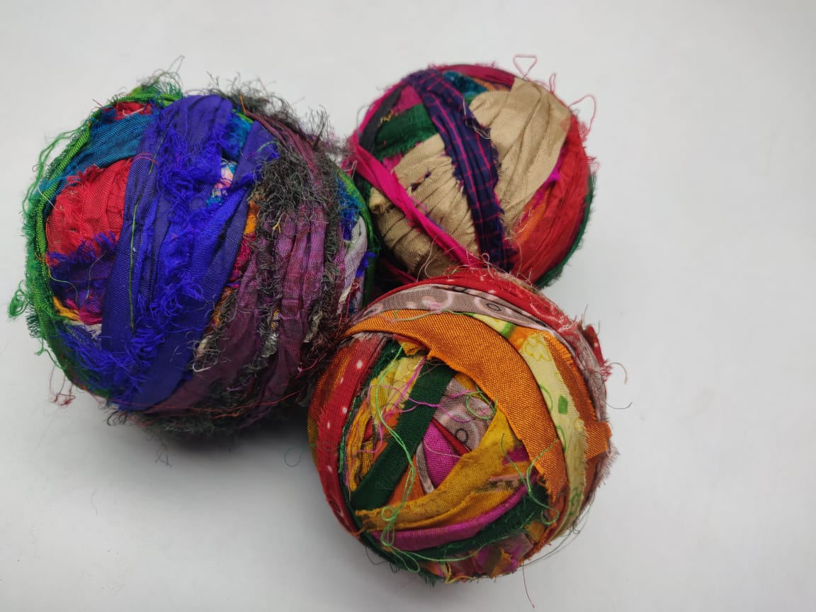 Recycled Sari silk Ribbon-Rolls is the by-product of colorful saris that women wear in India. It is the loose ends of saris collected from industrial mills in India that is torn in stripes and sewn end to end to make beautiful and col